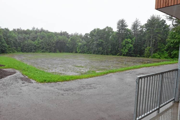  The playing field has been seeded at the new Greenfield Center School on Bernardston Road, which borders conservation land. STAFF PHOTO/PAUL FRANZ 