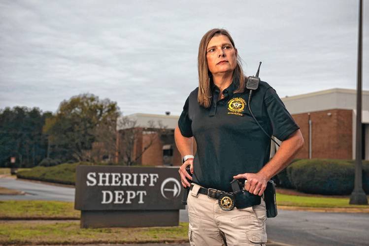    Anna Lange, a deputy sherriff in Georgia, transitioned from male to female and then had to sue her county government to get her health insurance to cover the change. PHOT BY ROBIN RAYNE   