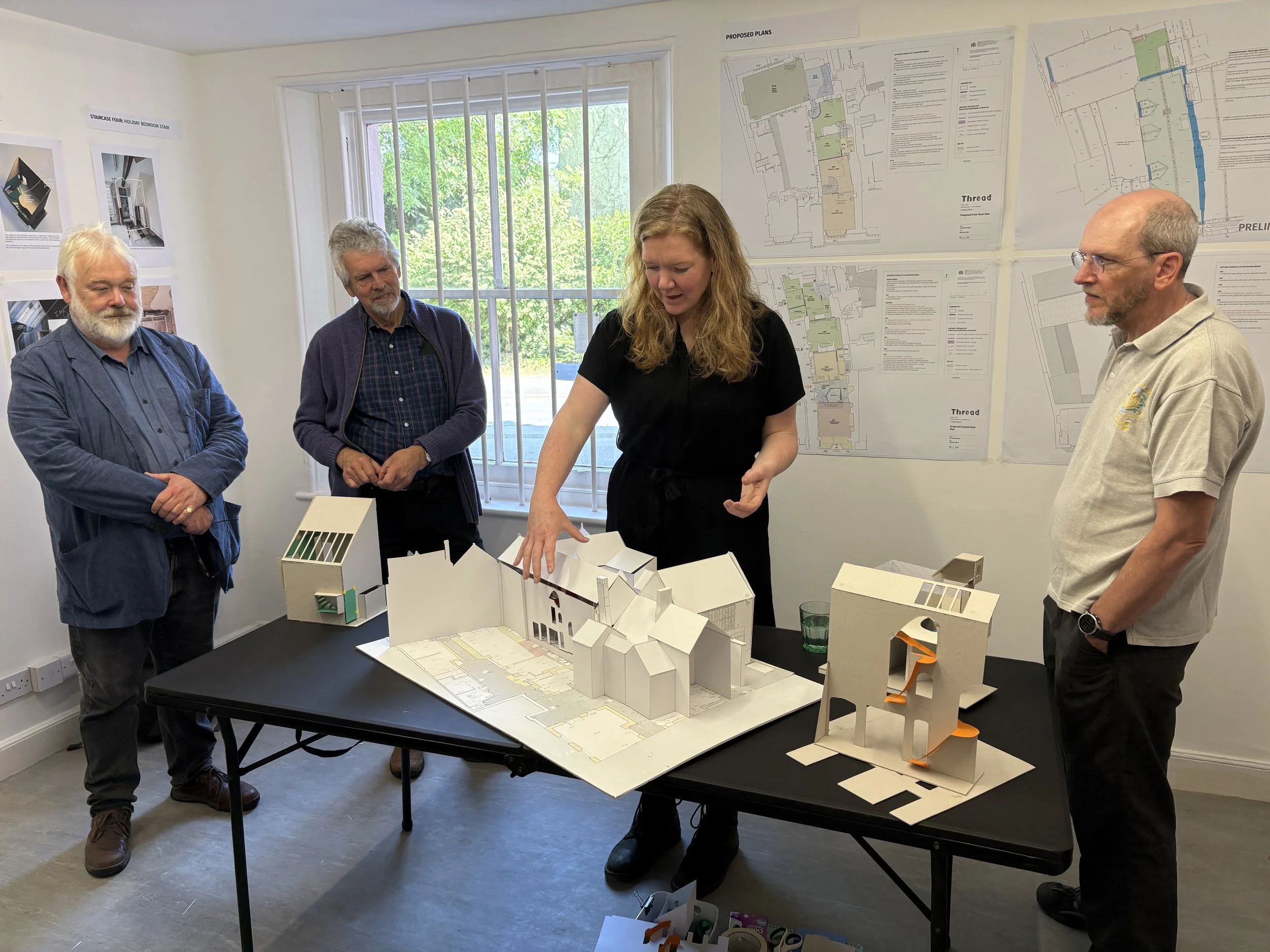 Jenny, Project Architect, presenting options to the client (the SWHT) via an exhibition of drawings and the models.