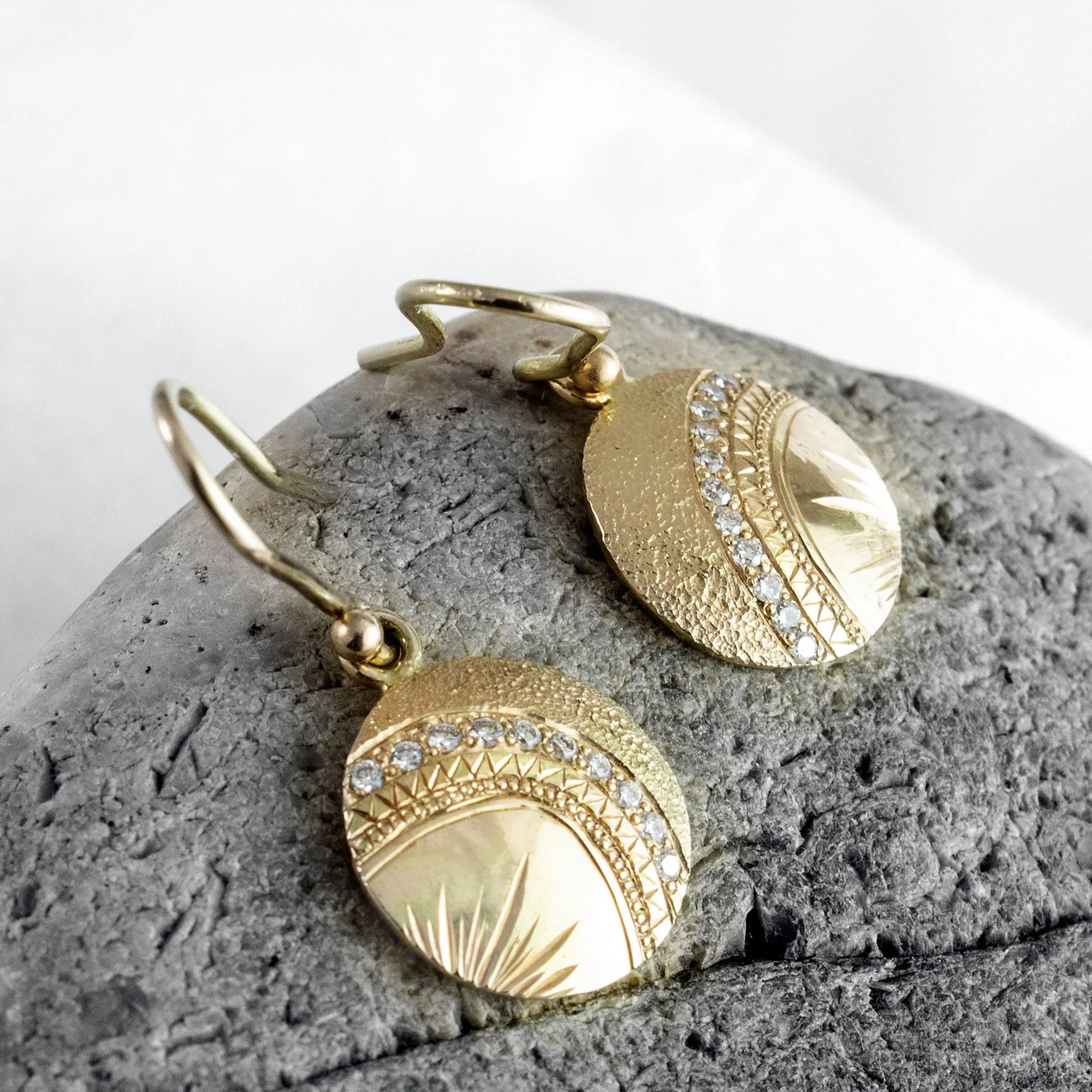 These exclusive gold diamond earrings are handcrafted just for her. From hand engraving and texturing, to the addition of sparkling white diamonds, every detail has been carefully considered to make her feel special. 