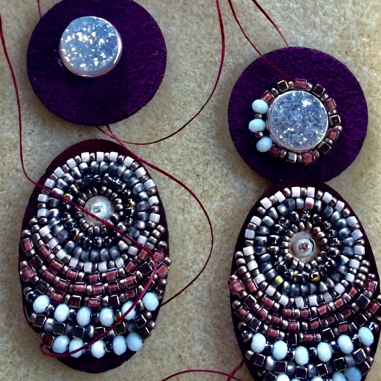 Beadwork earrings in the making; sewn on a deep ruby background with tiny pearls, opals and druzy stones...
#beadworkearringsatBeauty&amp;theBeads#B&amp;TBbeadworkearrings#semipreciousstonehandmadeearrings
