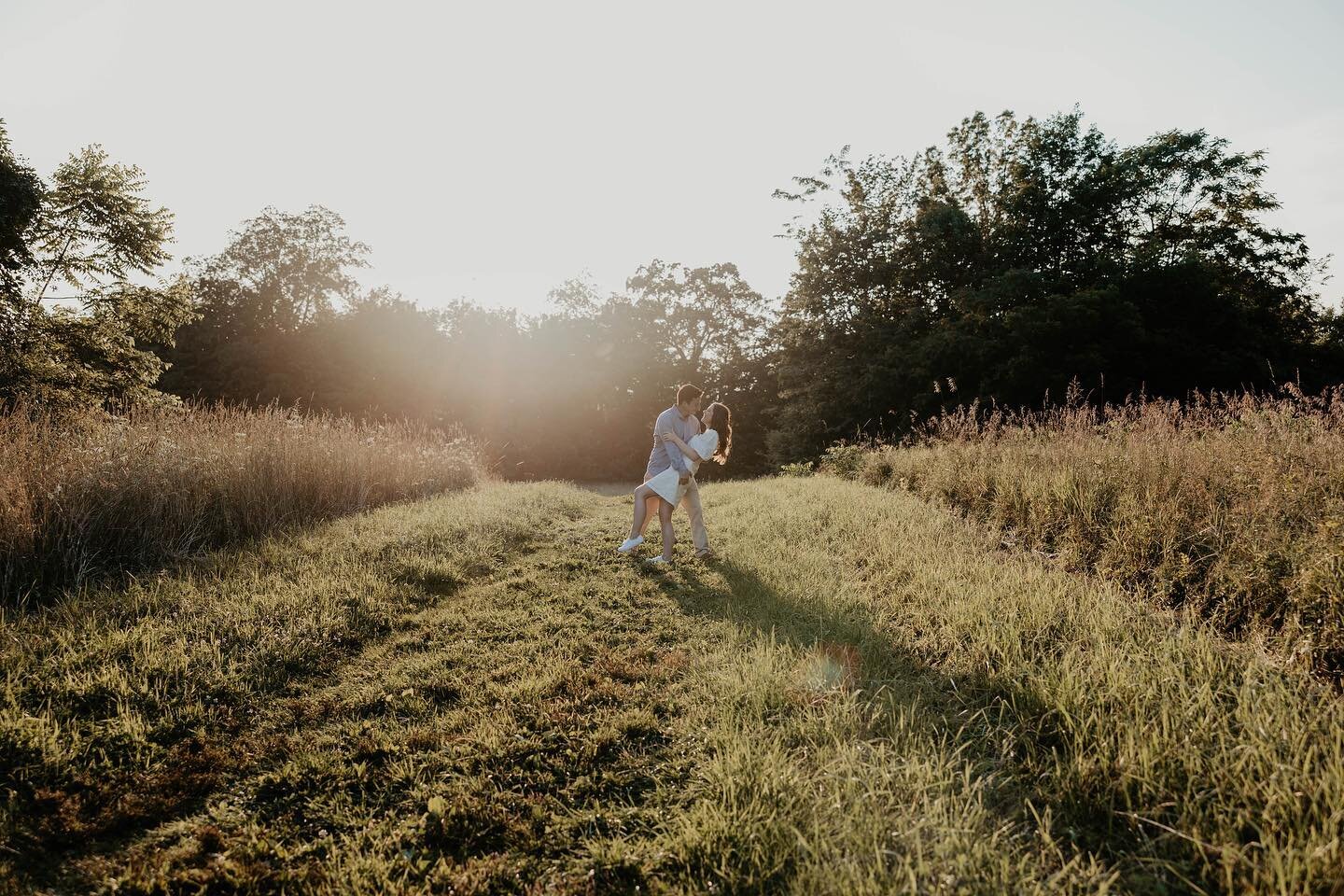 This past Friday certainly felt like a pressure cooker outside here in NY. Yet, it couldn&rsquo;t stop this magical engagement session. The cool breeze rustling through the wild flowers, while both the sun rays hit, and the moon peaked out, was an ad