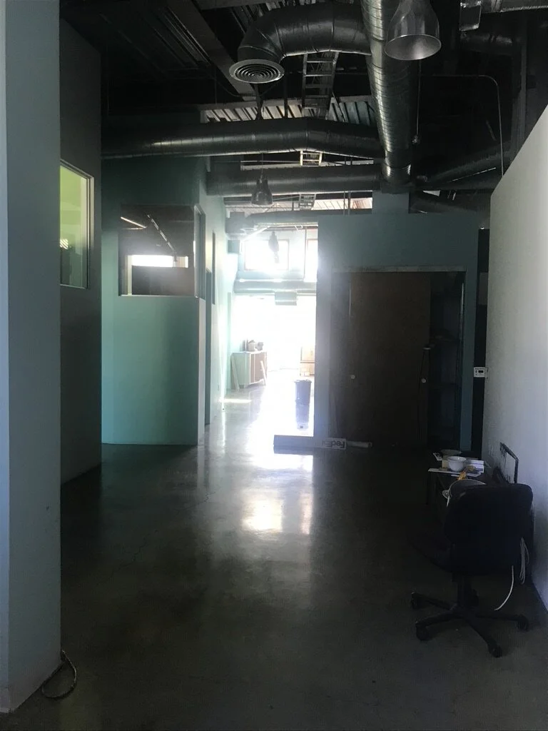 1...  The only daylight into the space was largely blocked by private offices and rooms that flanked the perimeter walls