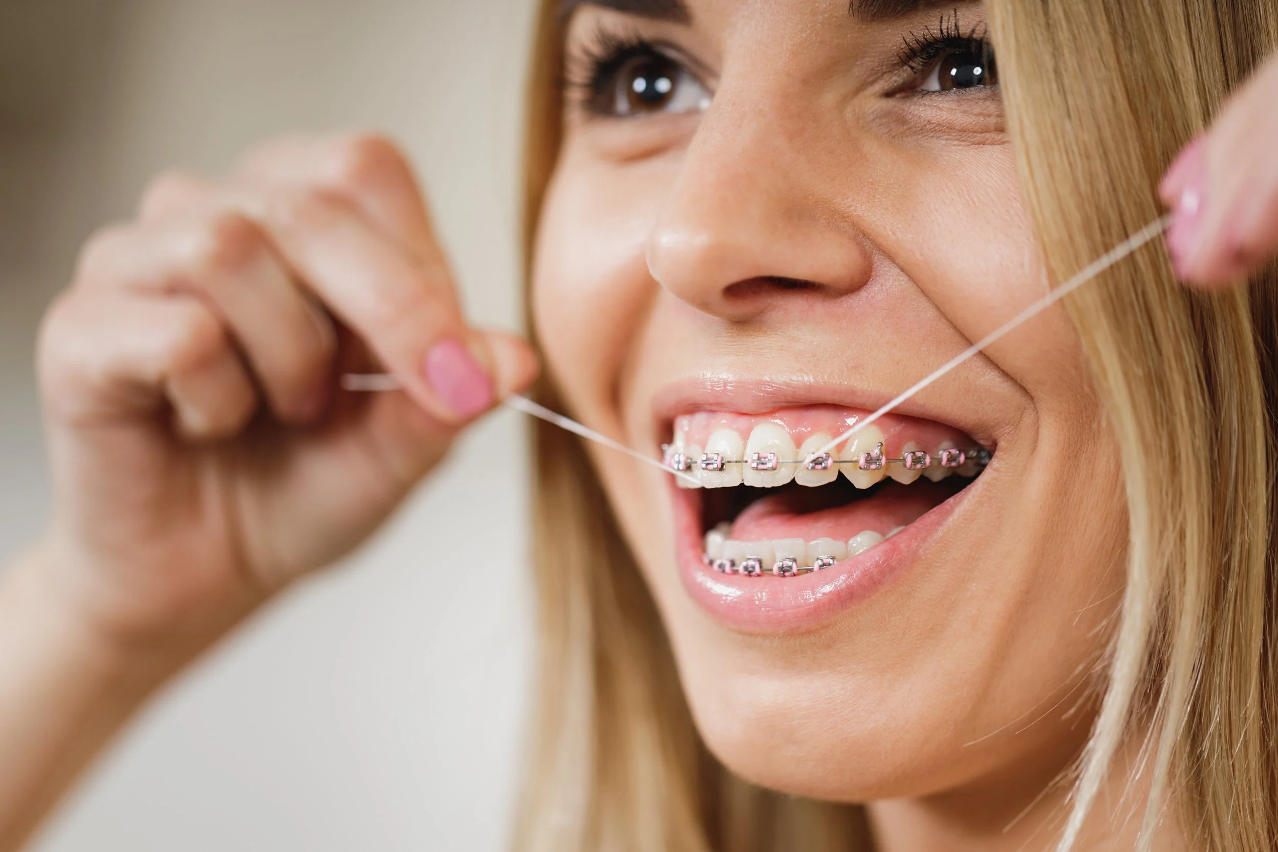 How do I floss with braces?