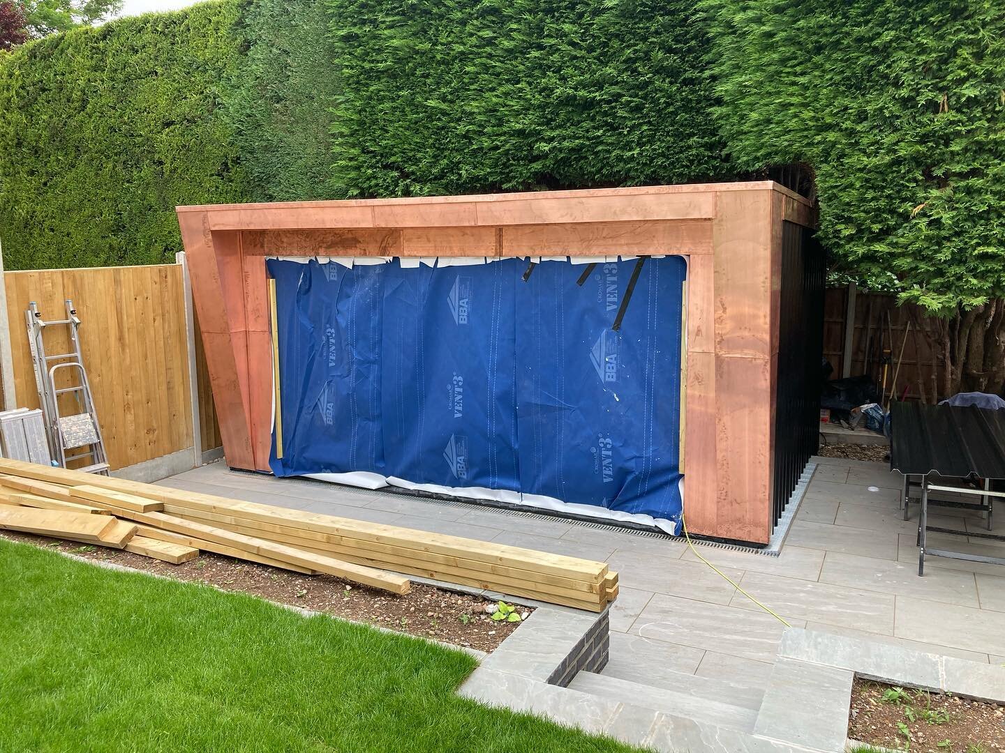 Antique copper cladding installed ready for doors to be installed. Metal cladding provides a permanent cladding solution which creates a quality timeless finish ✅