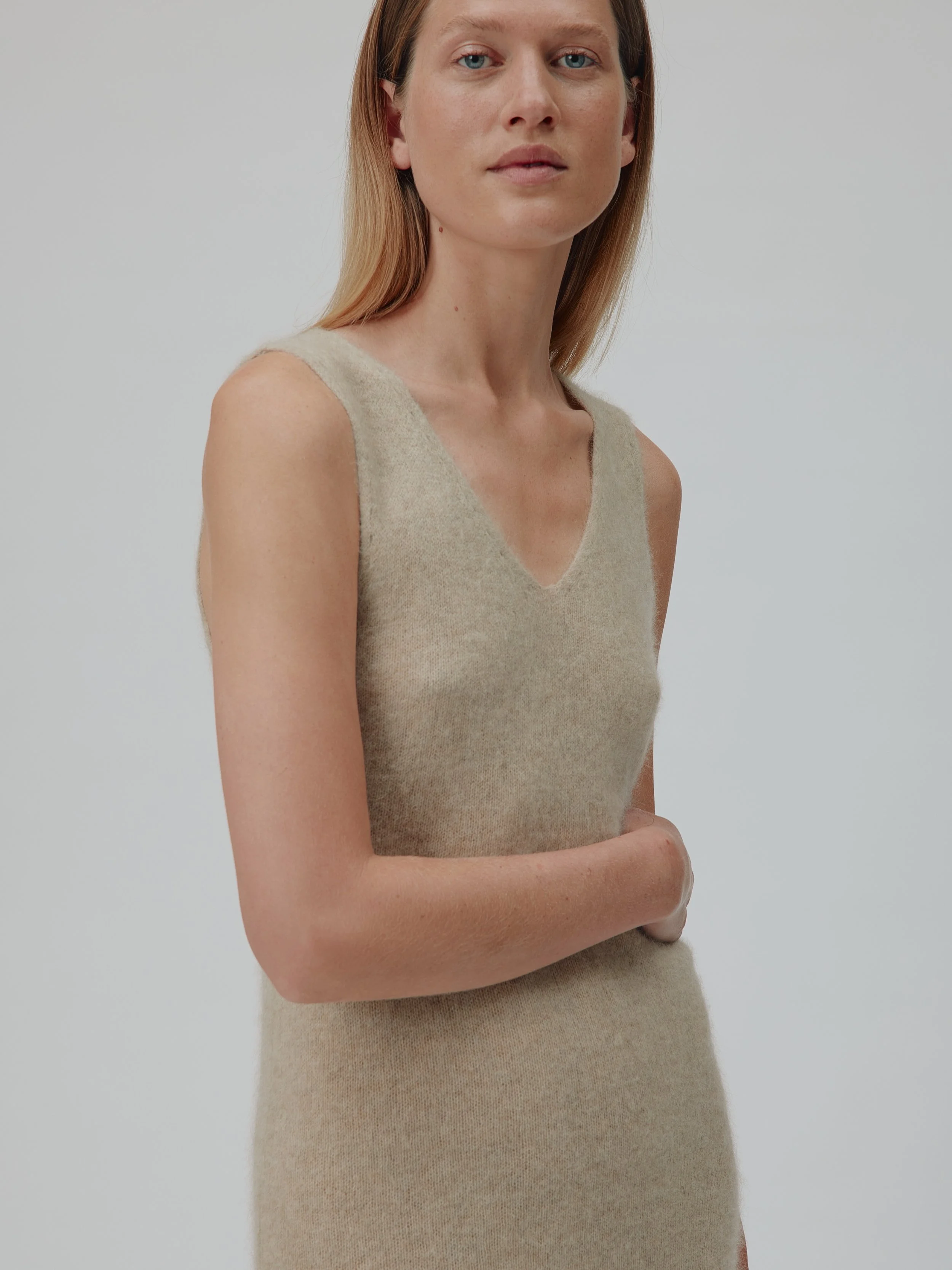 SIX &Aacute;MES

Zenia is a sleeveless dress in 100% ultra-soft Raccoon Wool. It features wide straps and a V-neckline at both the front and back, with a relaxed silhouette that falls to mid-calf length for an elegant, effortless look.

@sixames