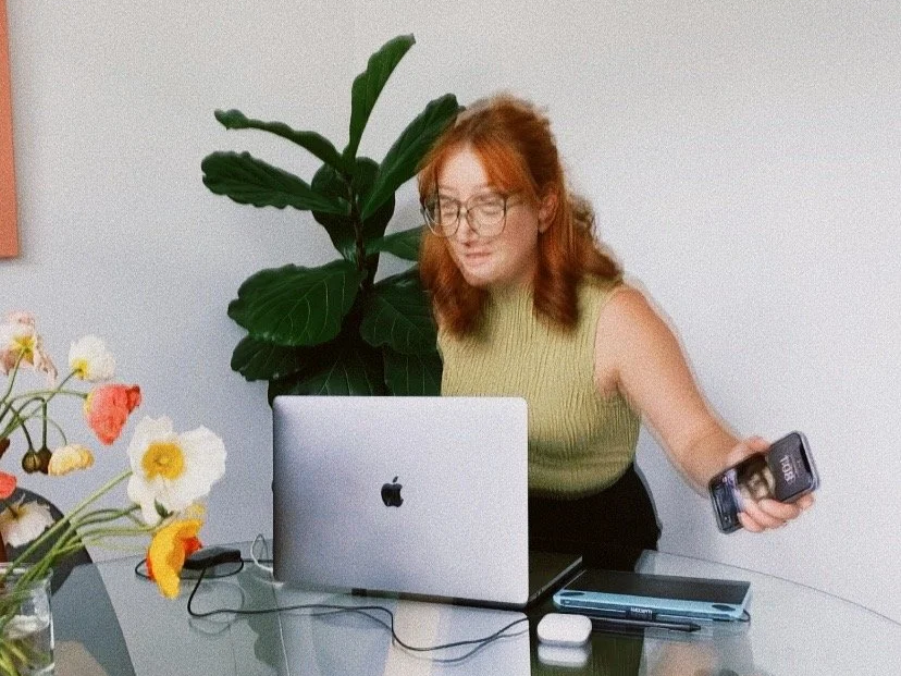 Modella Creative sitting down to build a brand or textile design for modern businesses, using a MacBook and Wacom tablet