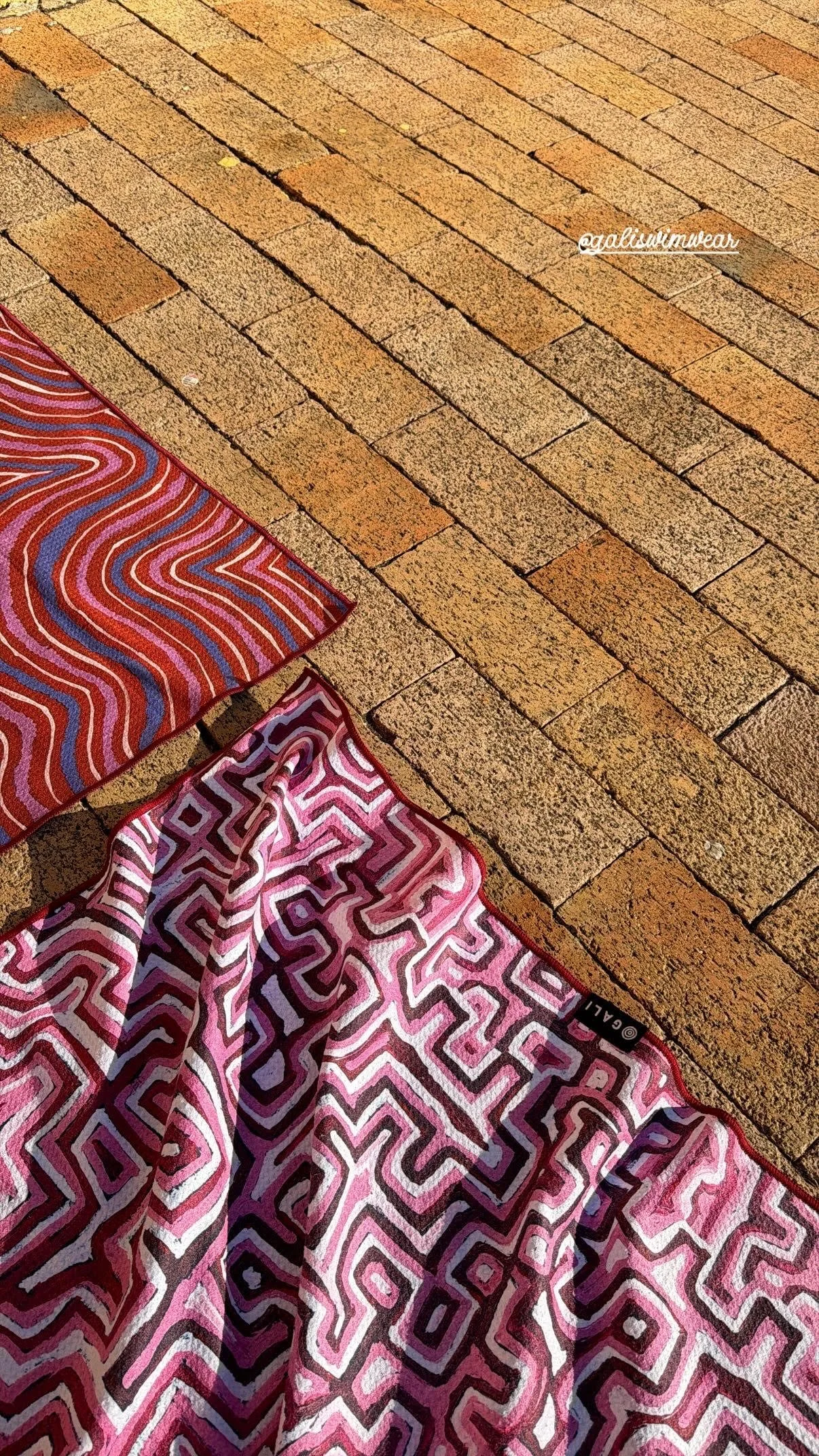 Towels with indigenous designs printed on waffle texture fabric, created by Modella Creative for Gali Swimwear