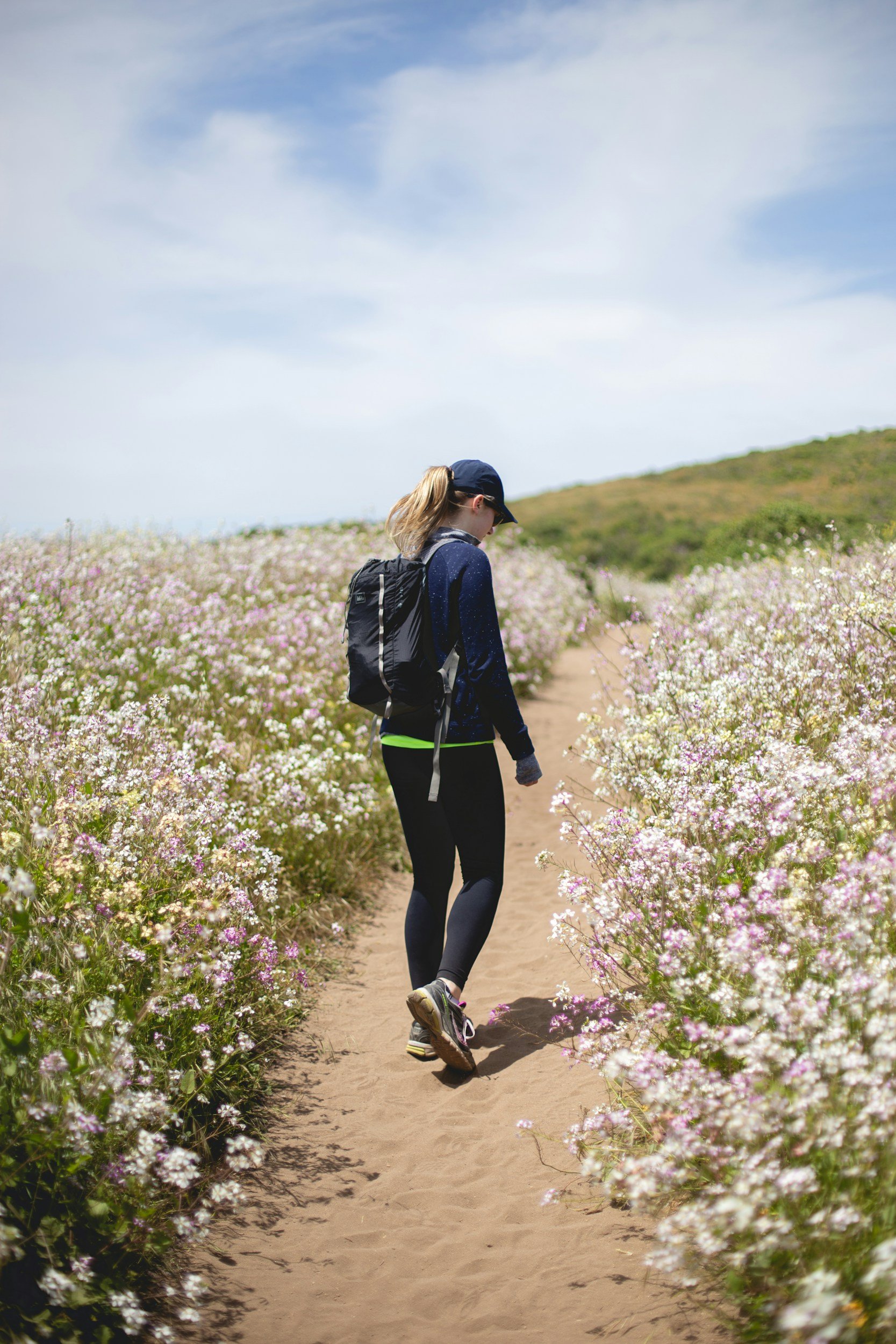 Women walking amongst flowers