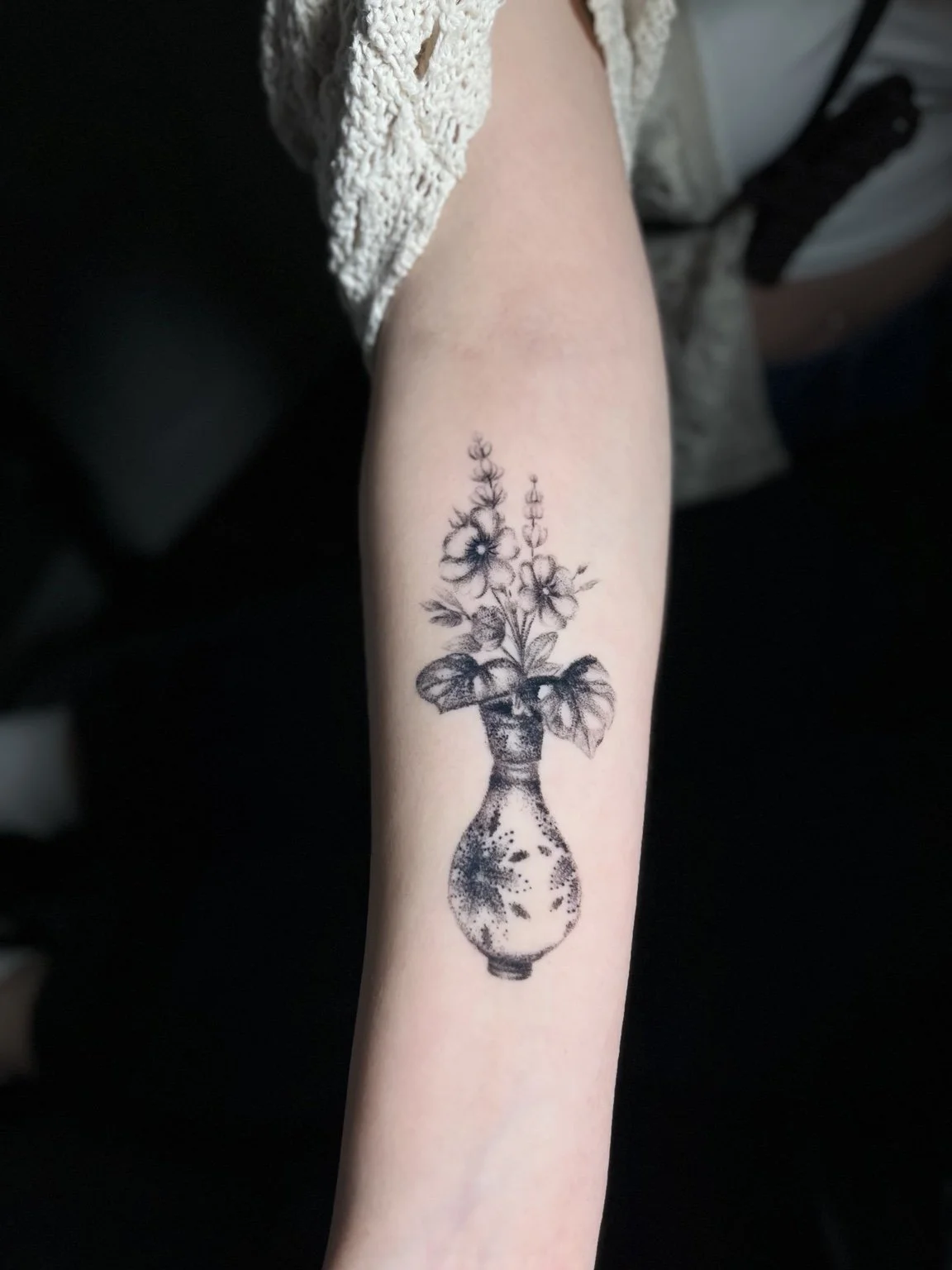 Dotwork floral vase tattoo by Andrew Tanner