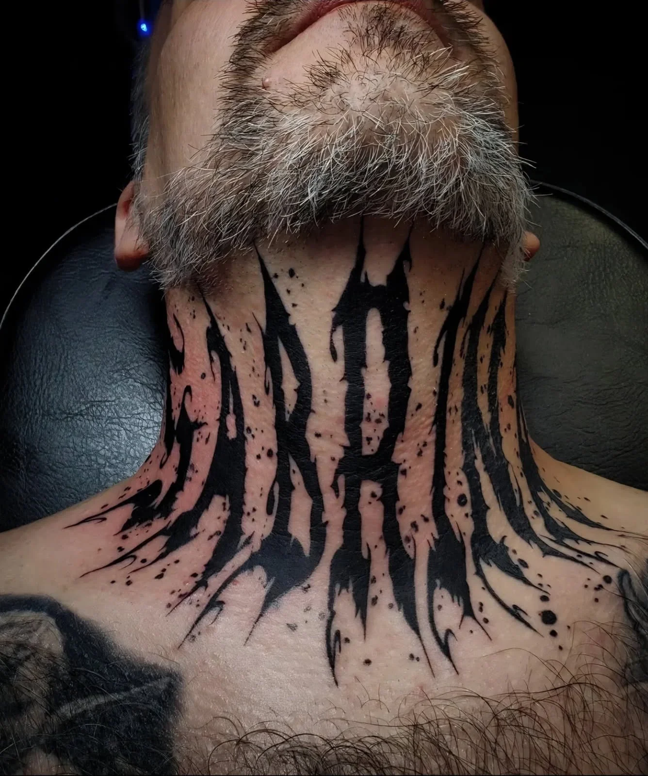 Abstract blackwork neck tattoo by Destiny