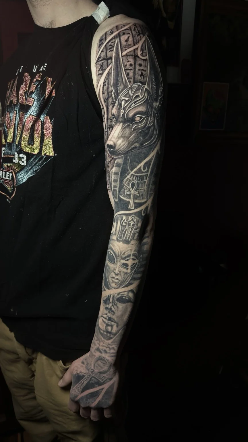 Black-and-grey Egyptian-themed sleeve tattoo by Damian Marinelli