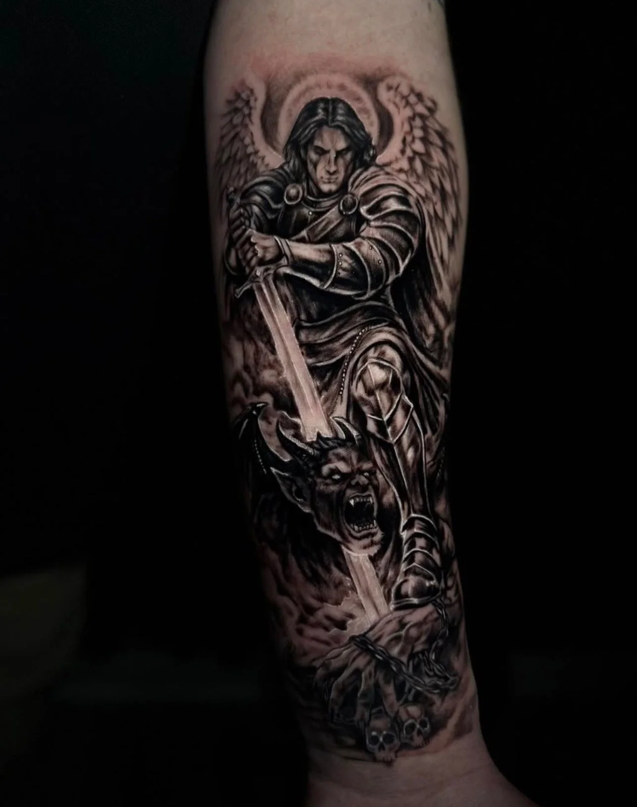 Black-and-grey winged warrior tattoo by Ren Giang