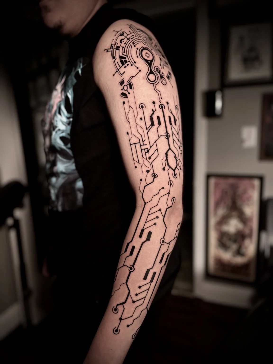 Geometric circuit sleeve tattoo by Andrew Tanner