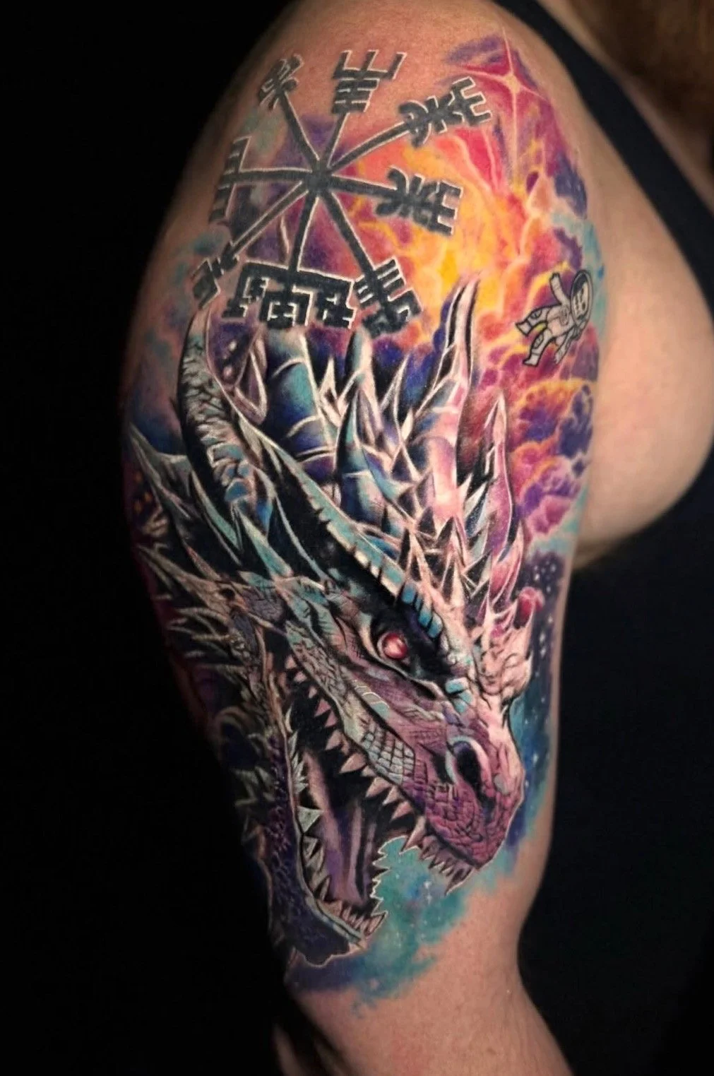Color dragon upper-arm tattoo by Ren Giang