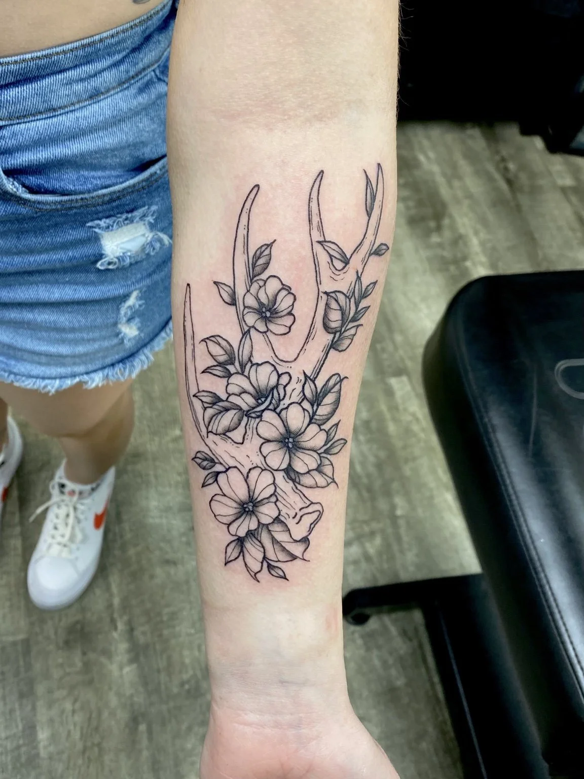 Antler and flowers forearm tattoo by Liz House