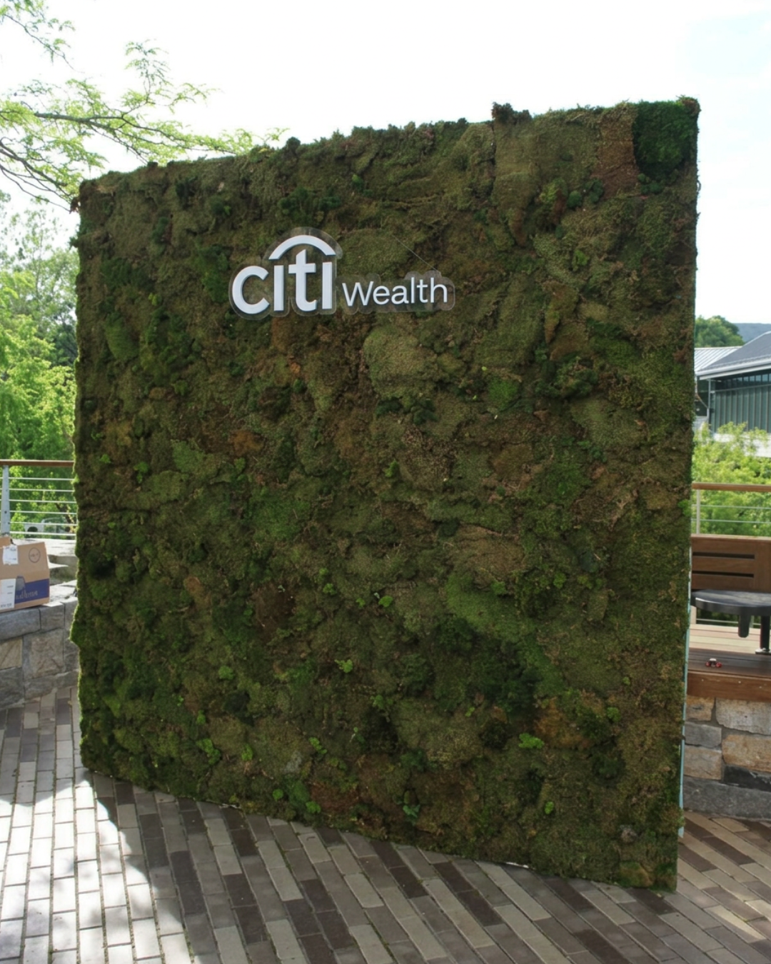 Custom moss wall installation for a Citi corporate event featuring branded signage and experiential event design.
