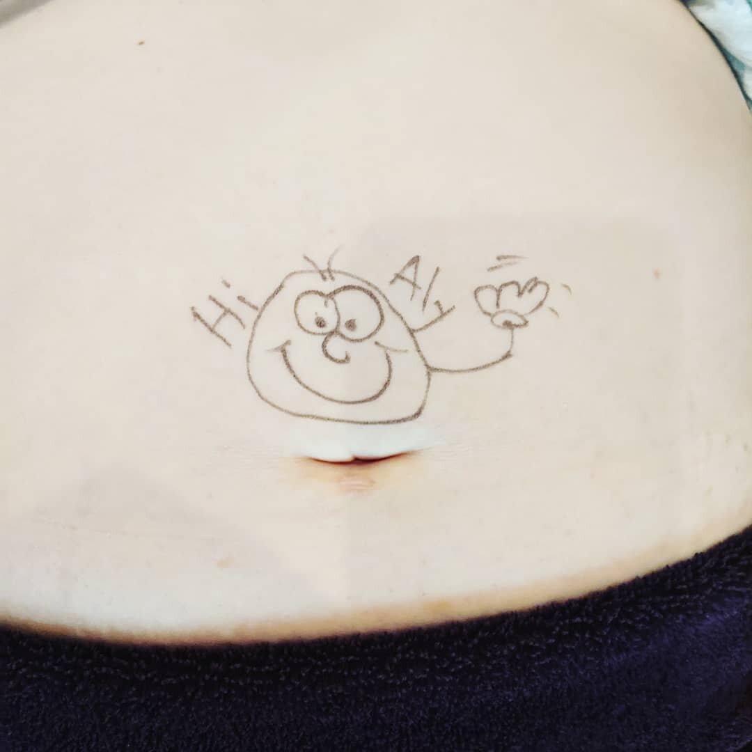 When your client has a sense of humor and you get a little surprise when it's time to feel the belly...