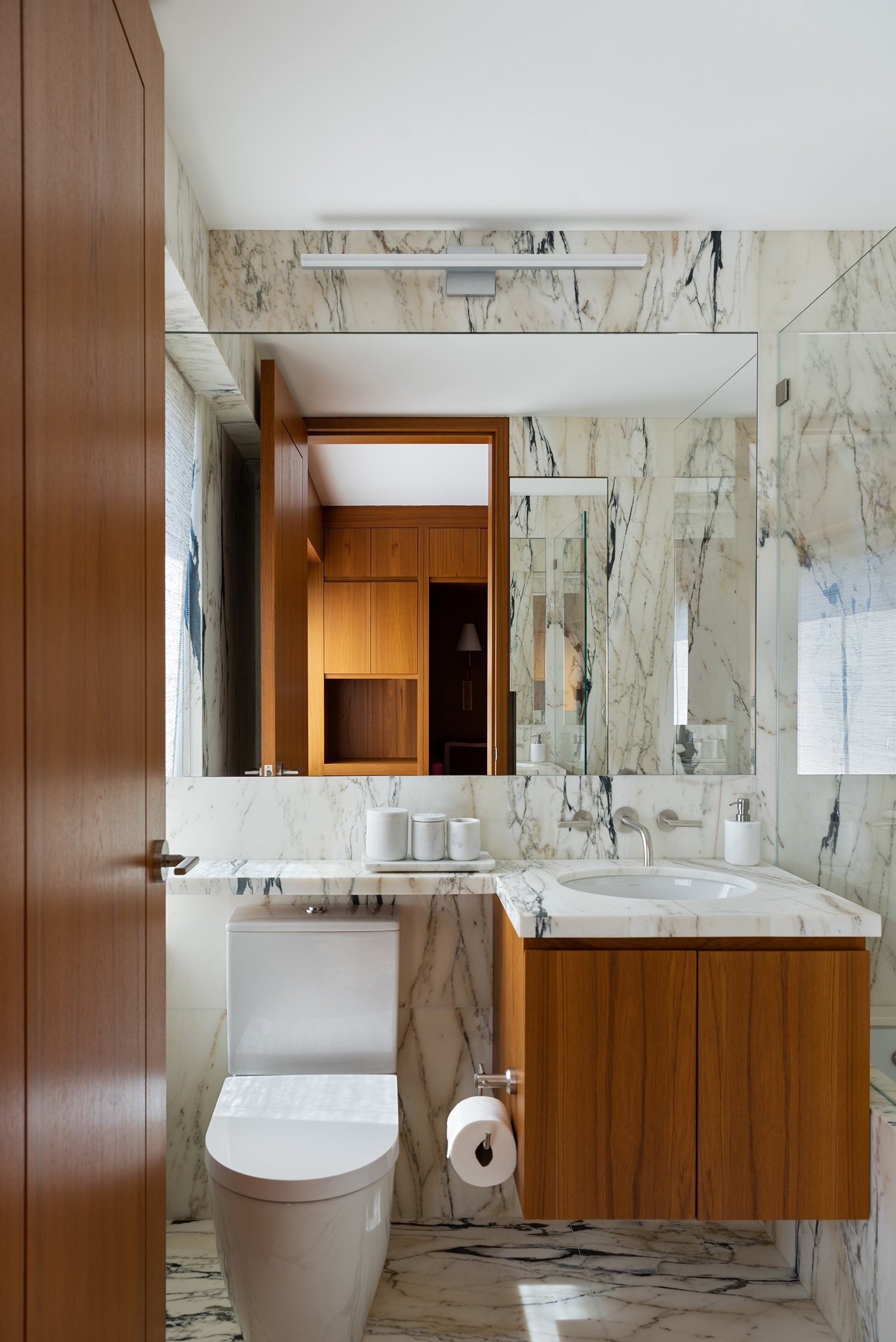 Midcentury Modern bathroom and powder room on Park Avenue in New York City by Luay Bahoora Architects