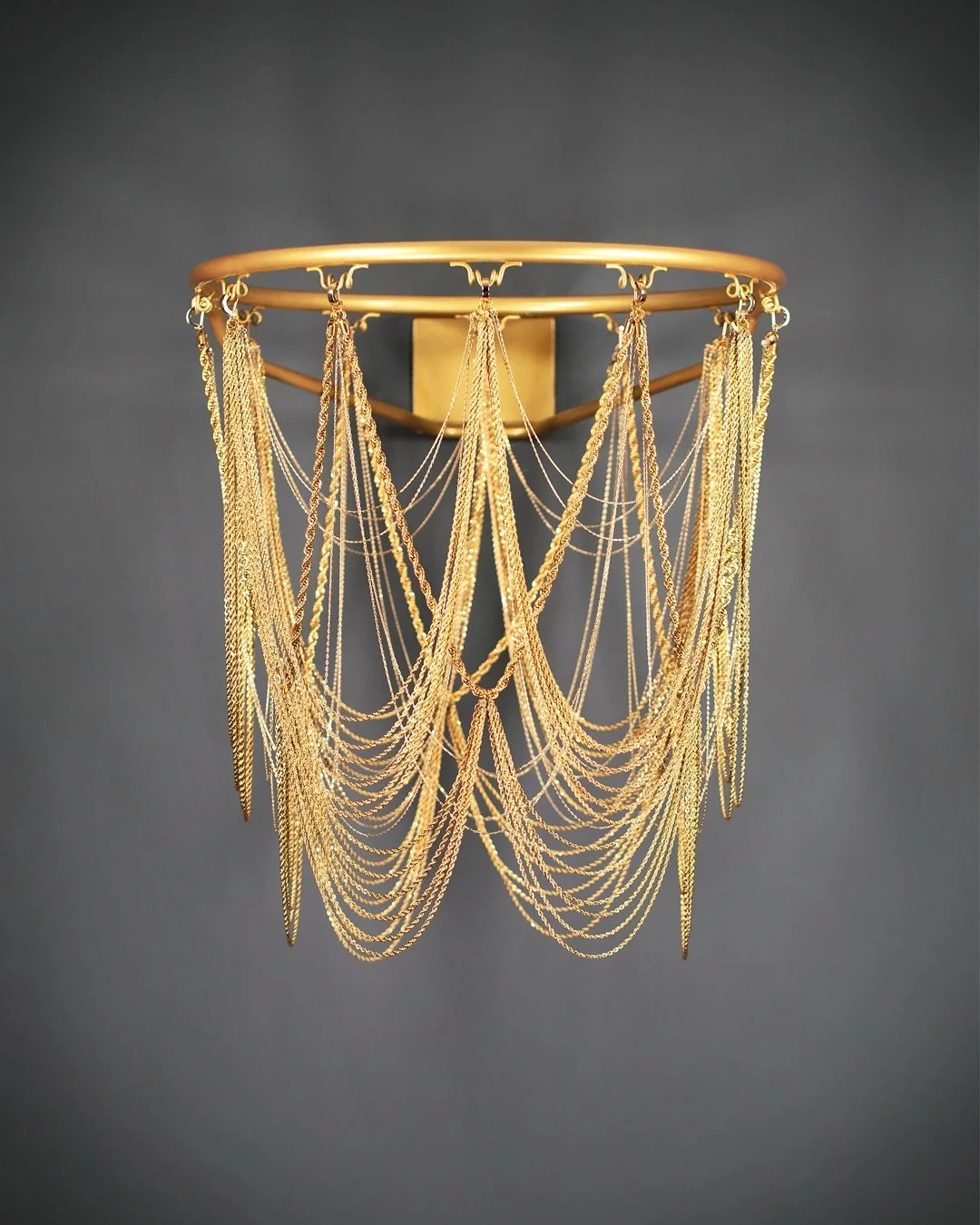 The Hustler 
Dress Code: Fall/Winter 2025

The Hustler opens the collection.
Draped in gold rope chain that scallops like layered necklaces, it glitters with swagger. A nod to Darryl Dawkins and hip-hop&rsquo;s embrace of gold as status.

The net bec