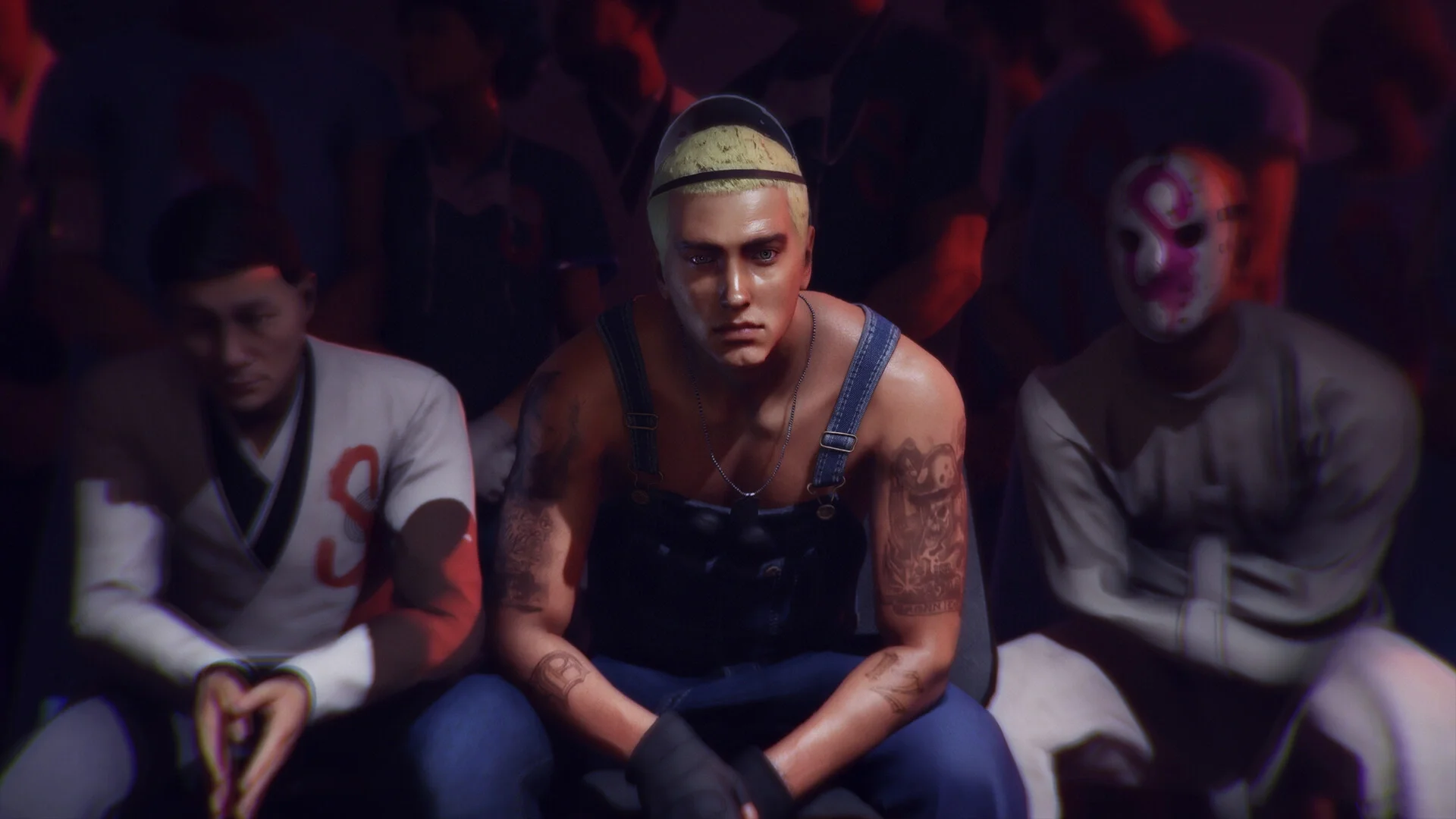 A screenshot from HITMAN 3 - The Eminem vs. Slim Shady Pack showing the Eminem character model wearing denim overalls, seated between two spectators, one in a gi and the other in a straight jacket and a hockey mask.