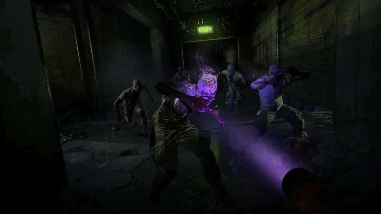 First-person gameplay screenshot from Dying Light 2 Stay Human showing infected enemies in a dark underground corridor retreating from a purple UV light.