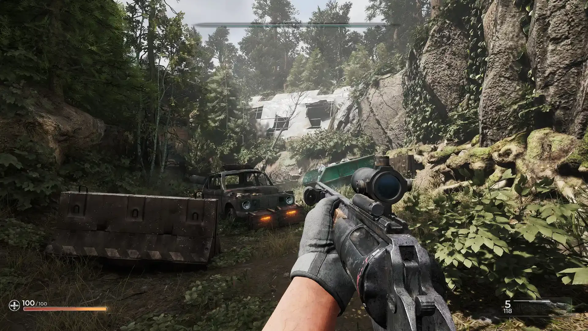 A first-person view of PIONER showing the player aiming a scoped rifle in an overgrown, post-apocalyptic ruin featuring a rusted car and a demolished trailer.