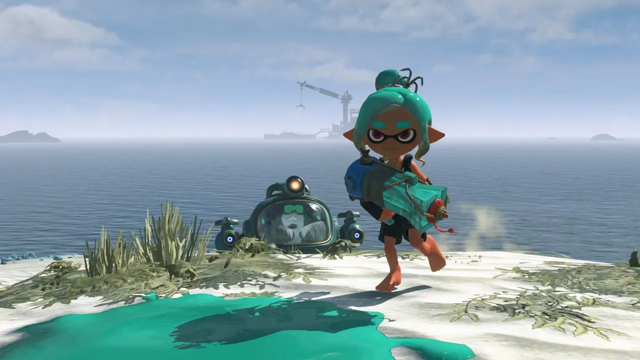 A teal-haired character in Splatoon Raiders stands on a white sandy beach holding a heavy ink weapon, with a small submarine and ocean in the background.
