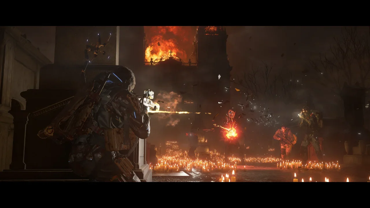 Third-person combat gameplay from Death Stranding 2: On the Beach featuring a gunfight in a candlelit cemetery against the backdrop of a large burning building.