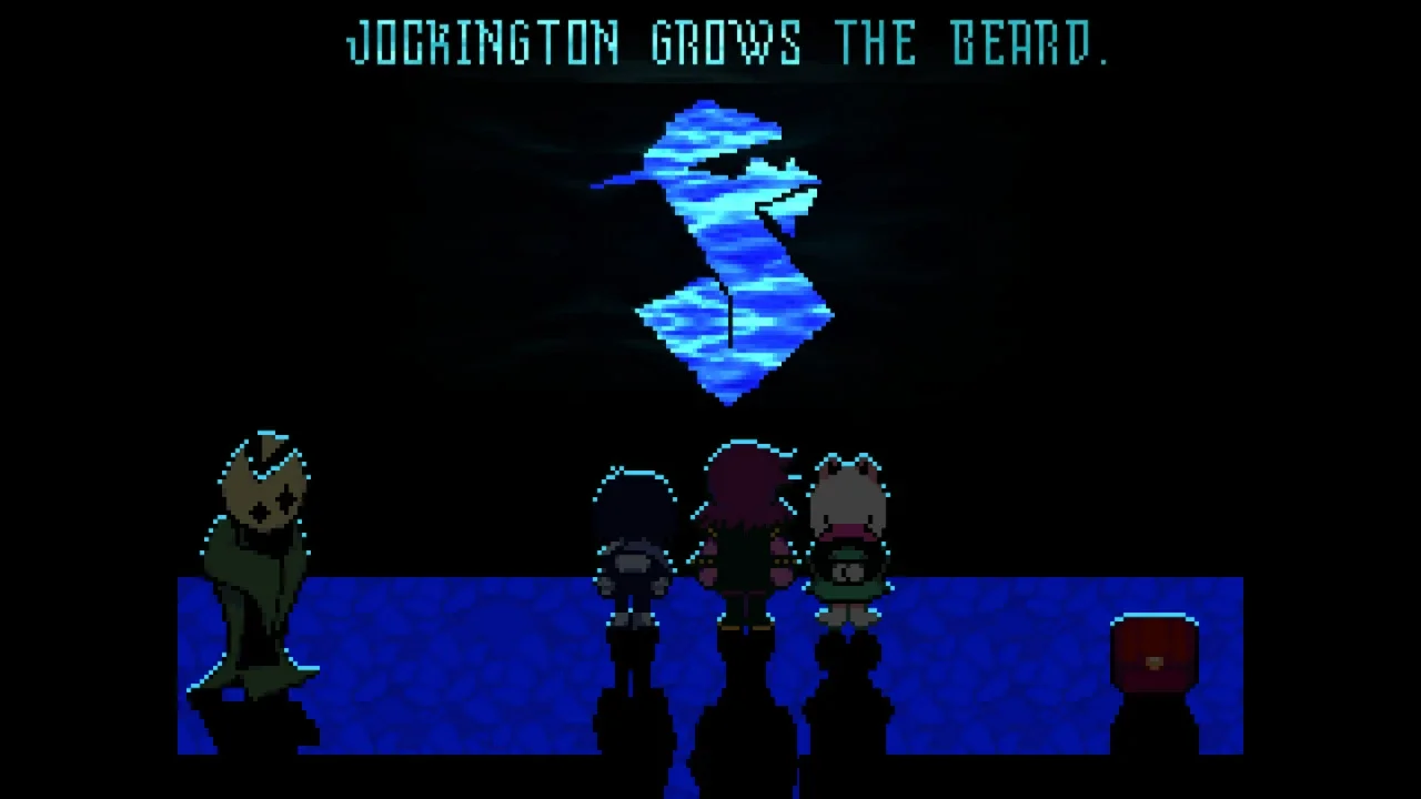 Deltarune gameplay screenshot featuring Kris, Susie, and Ralsei standing before a glowing blue diamond symbol with the text "JOCKINGTON GROWS THE BEARD" at the top.