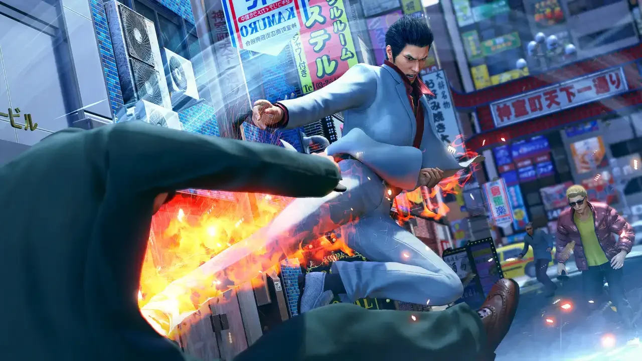 Kiryu Kazuma executing a fiery Heat Action finishing move on a street thug in the neon-lit urban environment of Kamurocho in Yakuza Kiwami 3.