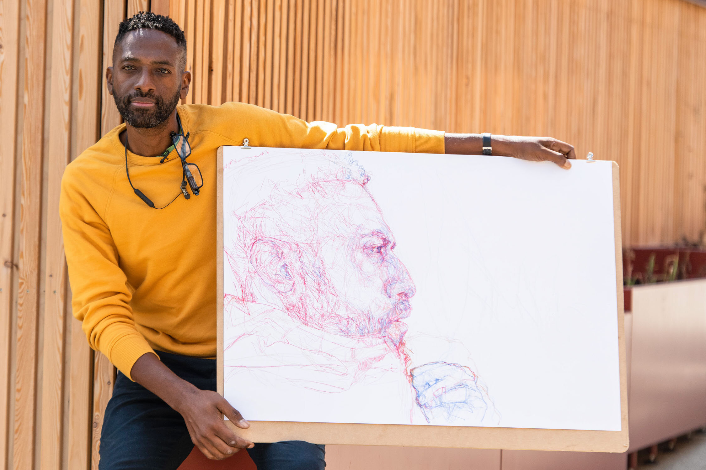 Curtis with his self portrait submission for Portrait Artist of The Year