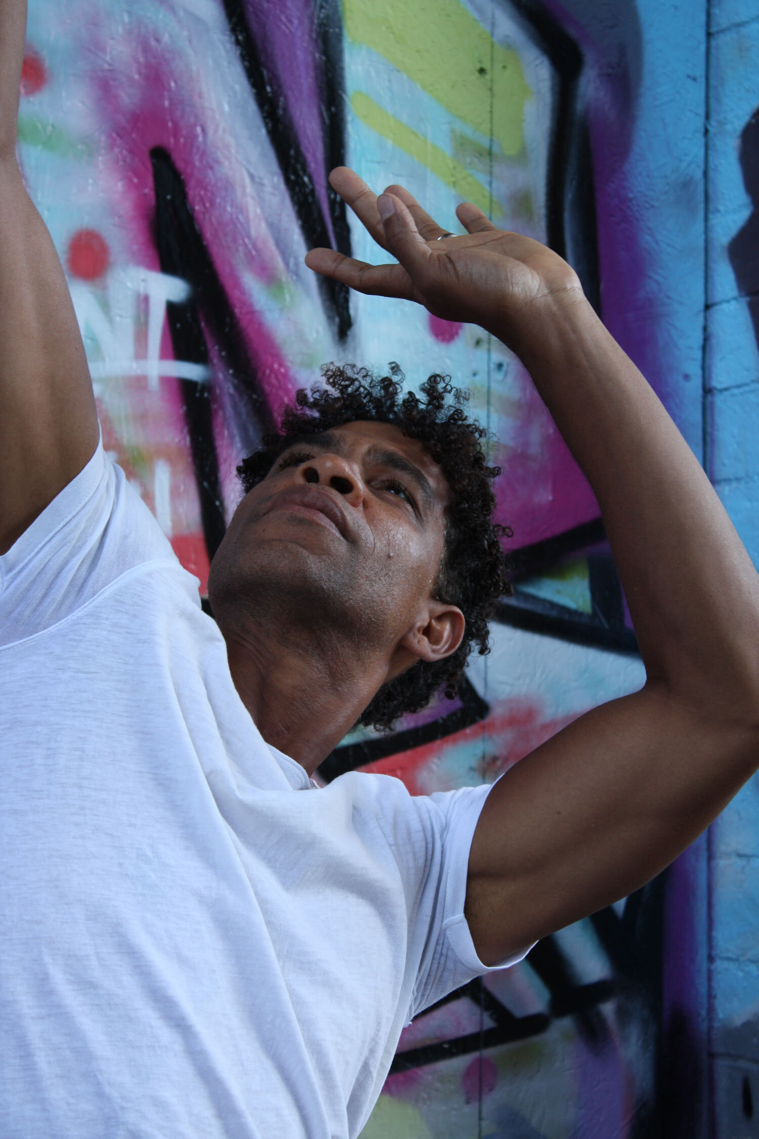 Close-up of ballet dancer Carlos Acosta dancing in front of graffiti for the final commission of Sky Arts Portrait Artist of the Year 2020 by Curtis Holder