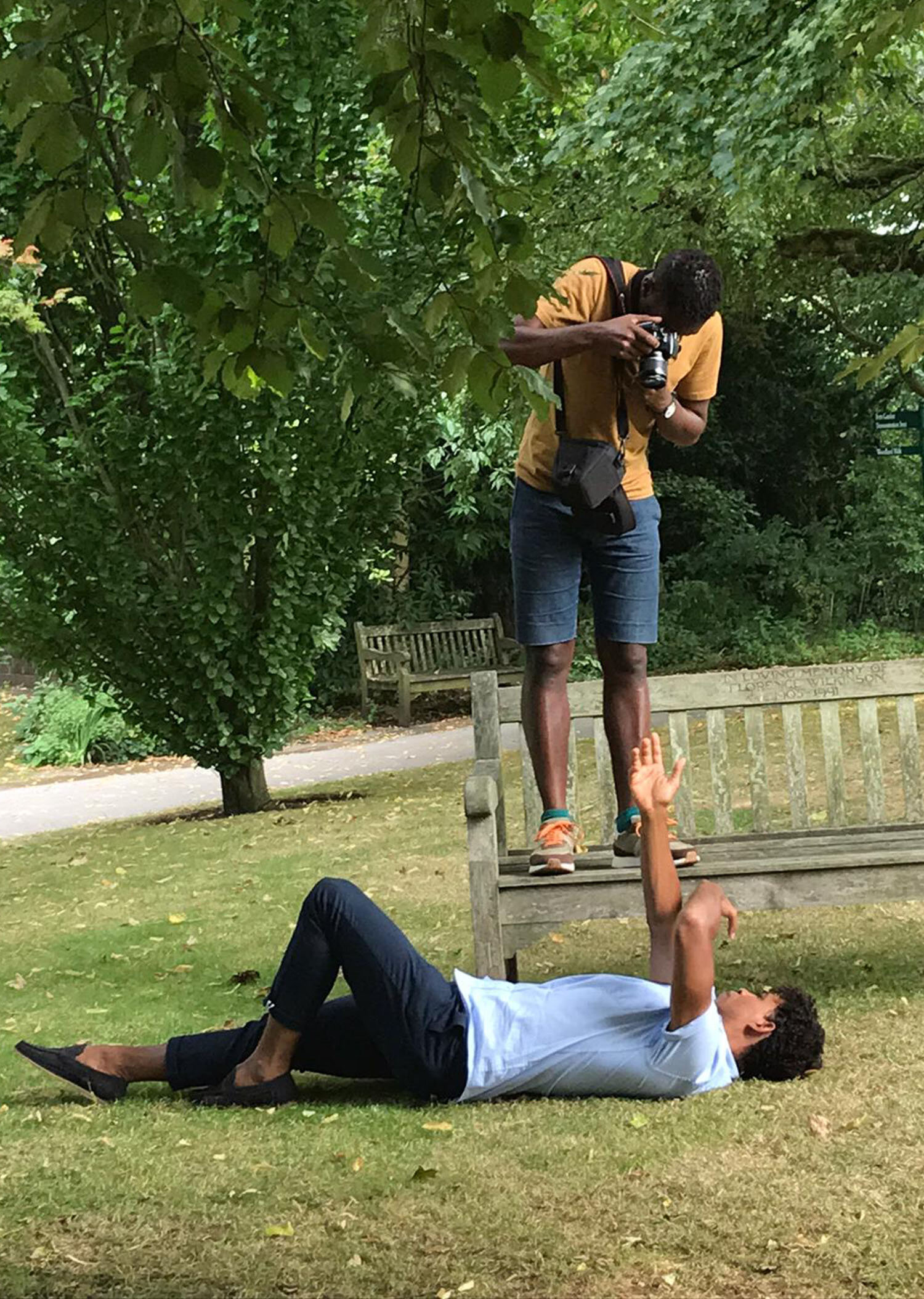 Winner of Sky Arts Portrait Artist of the Year 2020 Curtis Holder photographing ballet dancer Carlos Acosta lying down for the winner's portrait commission 