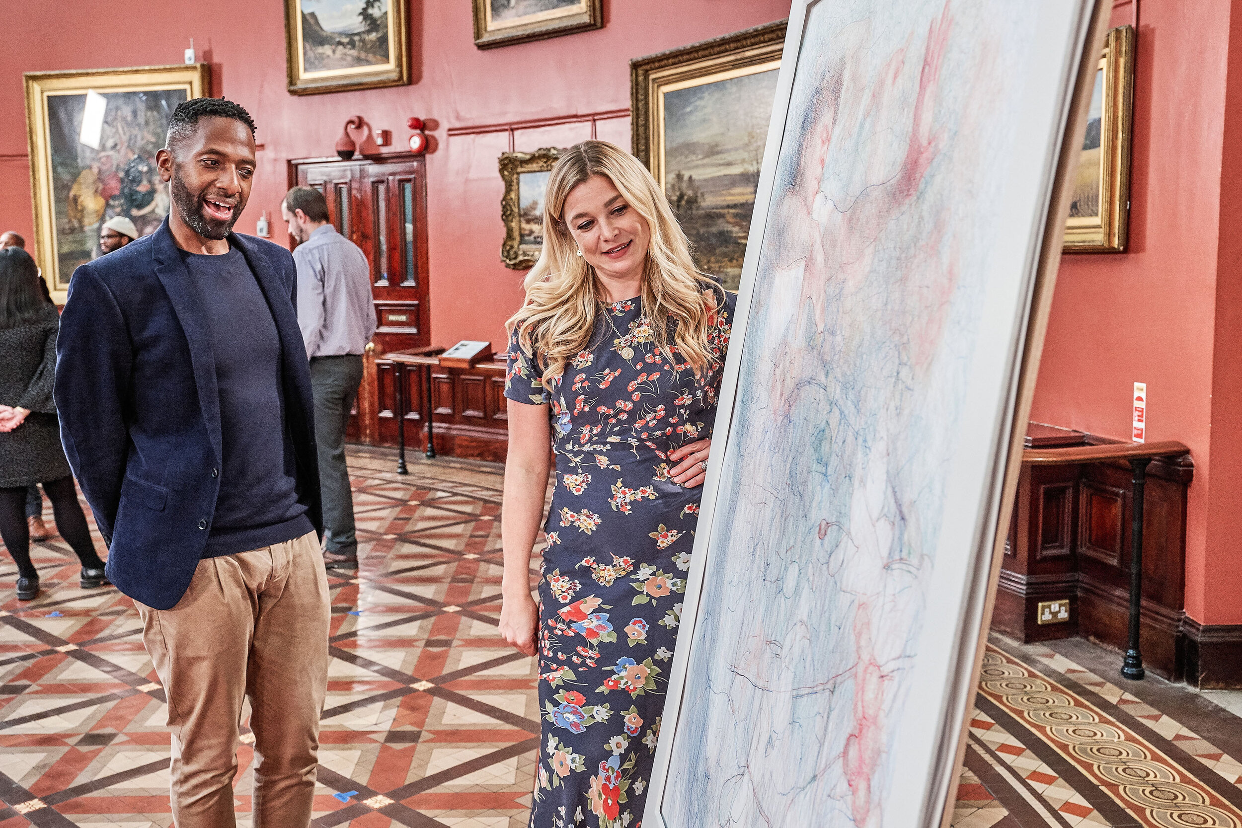 Sky Arts Portrait Artist of the Year judge Kate Bryan and winning artist Curtis Holder look at his portrait commission of ballet dancer Carlos Acosta at the Birmingham Museum and Art Gallery 