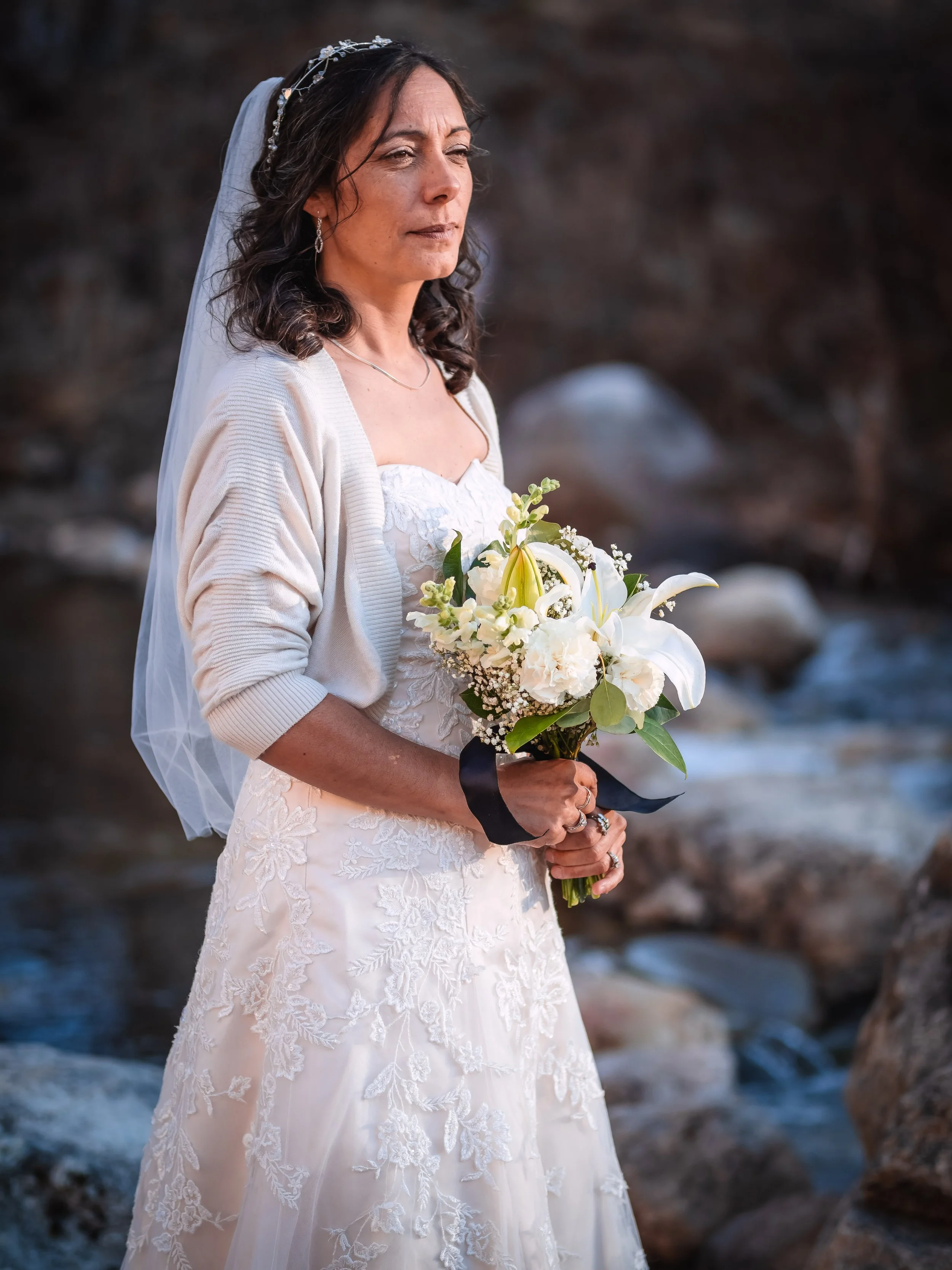 Woman getting married on her wedding day in a white dress with flowers