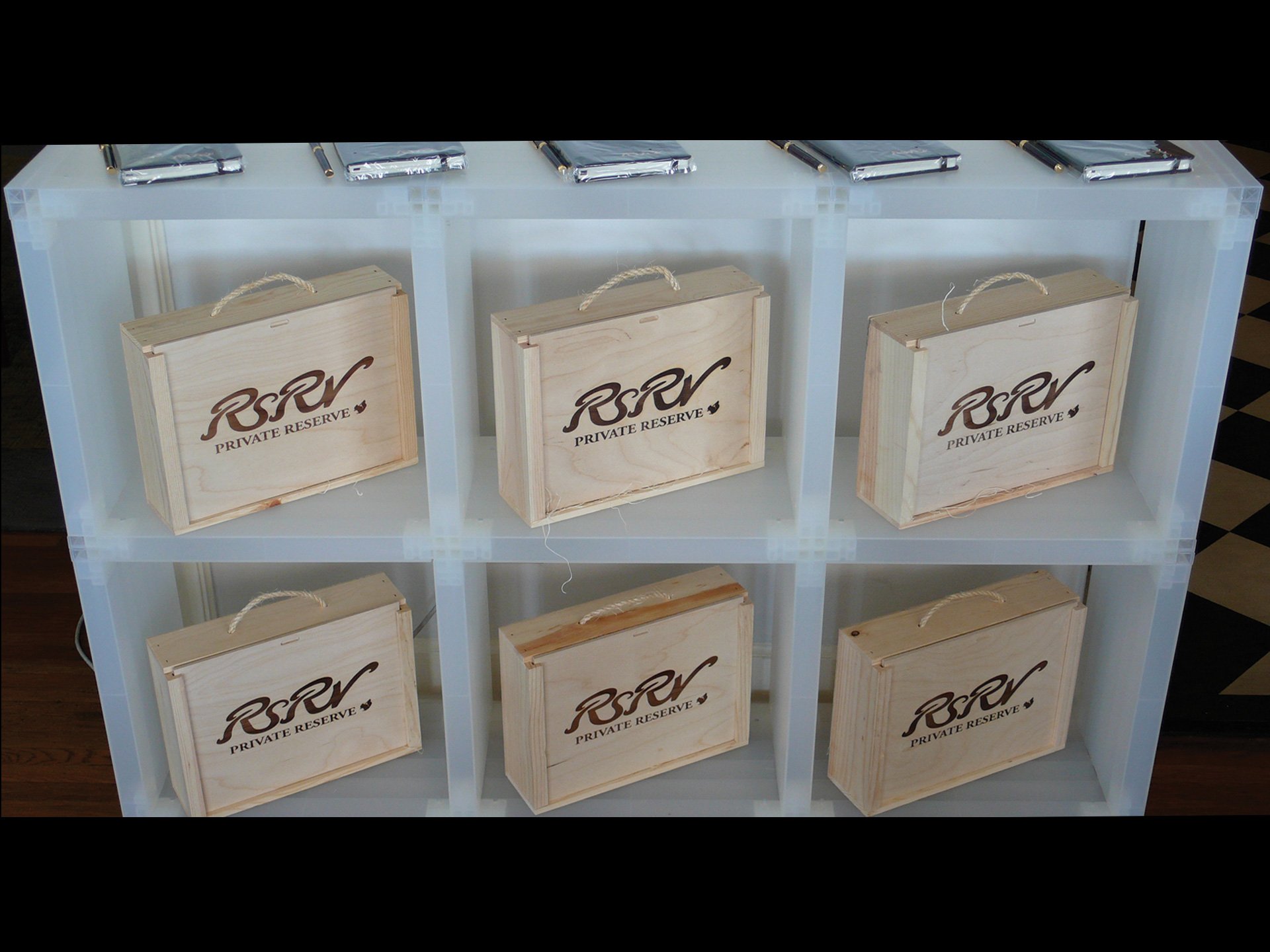 Press Kit Design. Wooden wine crates were repurposed for press kit packaging for RSRV Menswear. The Private Reserve theme connected to the brand name "RSRV".