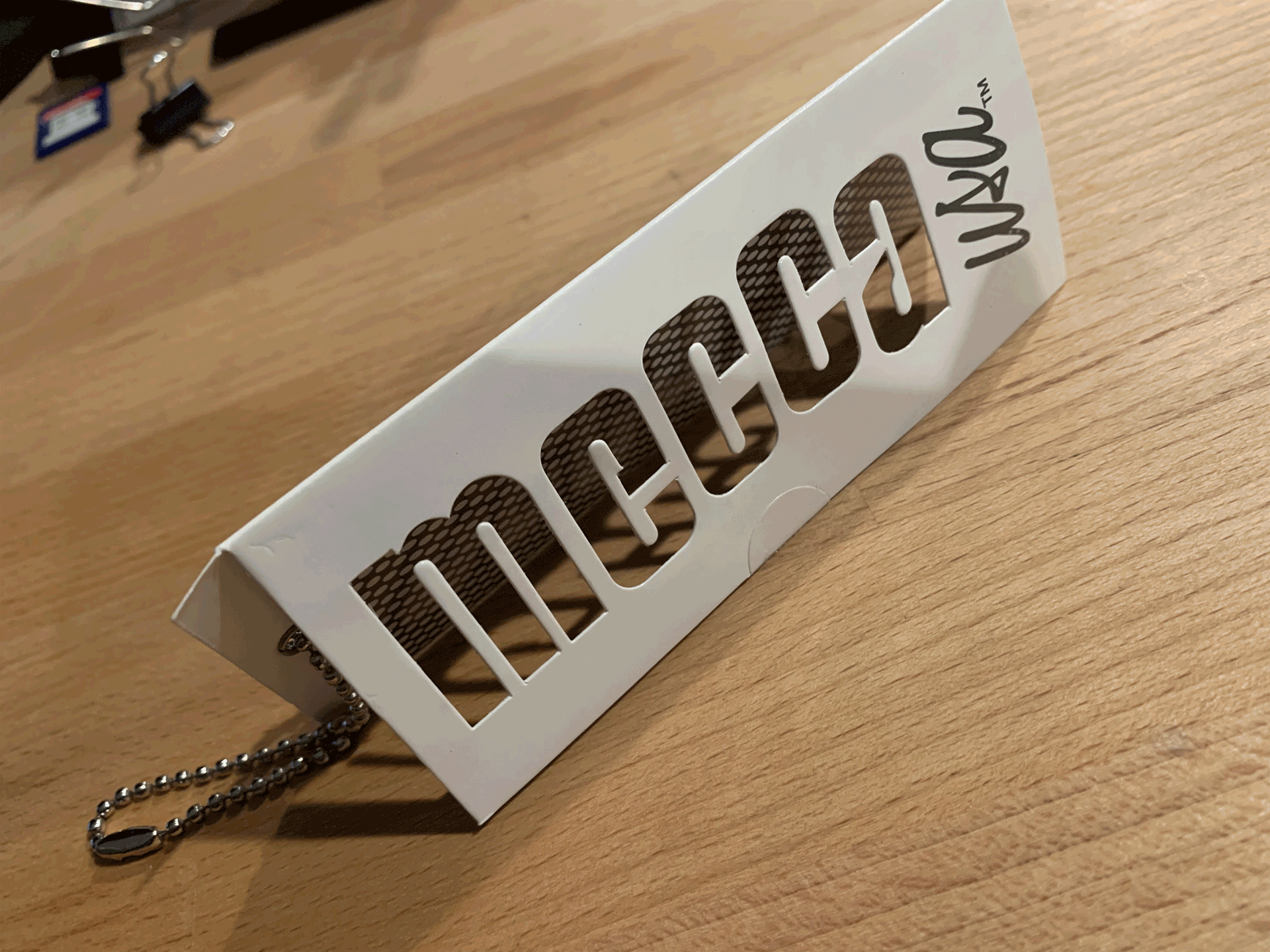 Tri Lingual Stencil Hangtag Designed for Mecca United Sports Apparel
