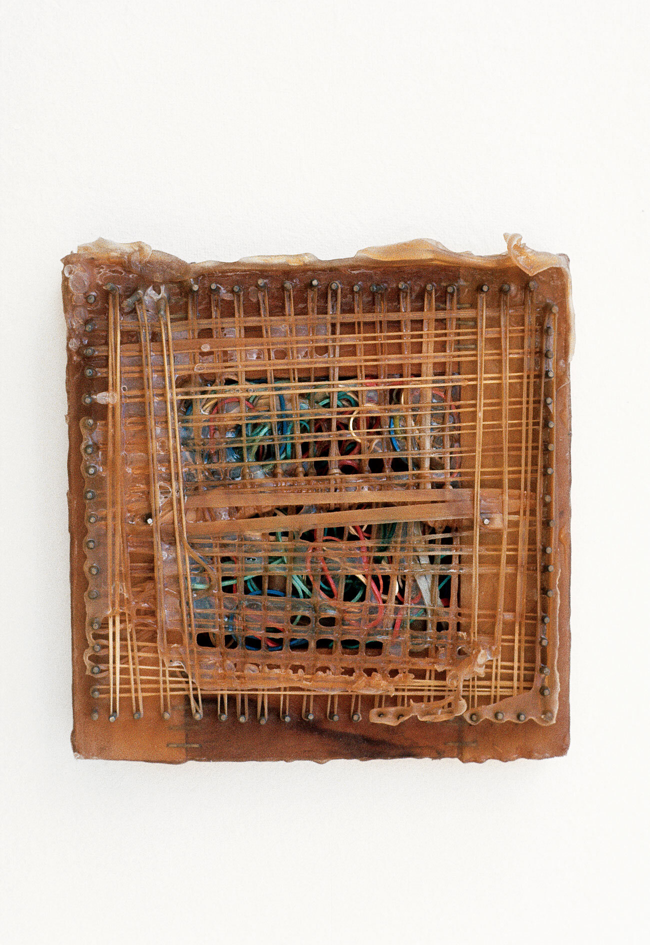   Rubber Band Glue Factory,  1970, rubber latex, rubber bands, wood, staples, 8 x 8 x 1 inches 