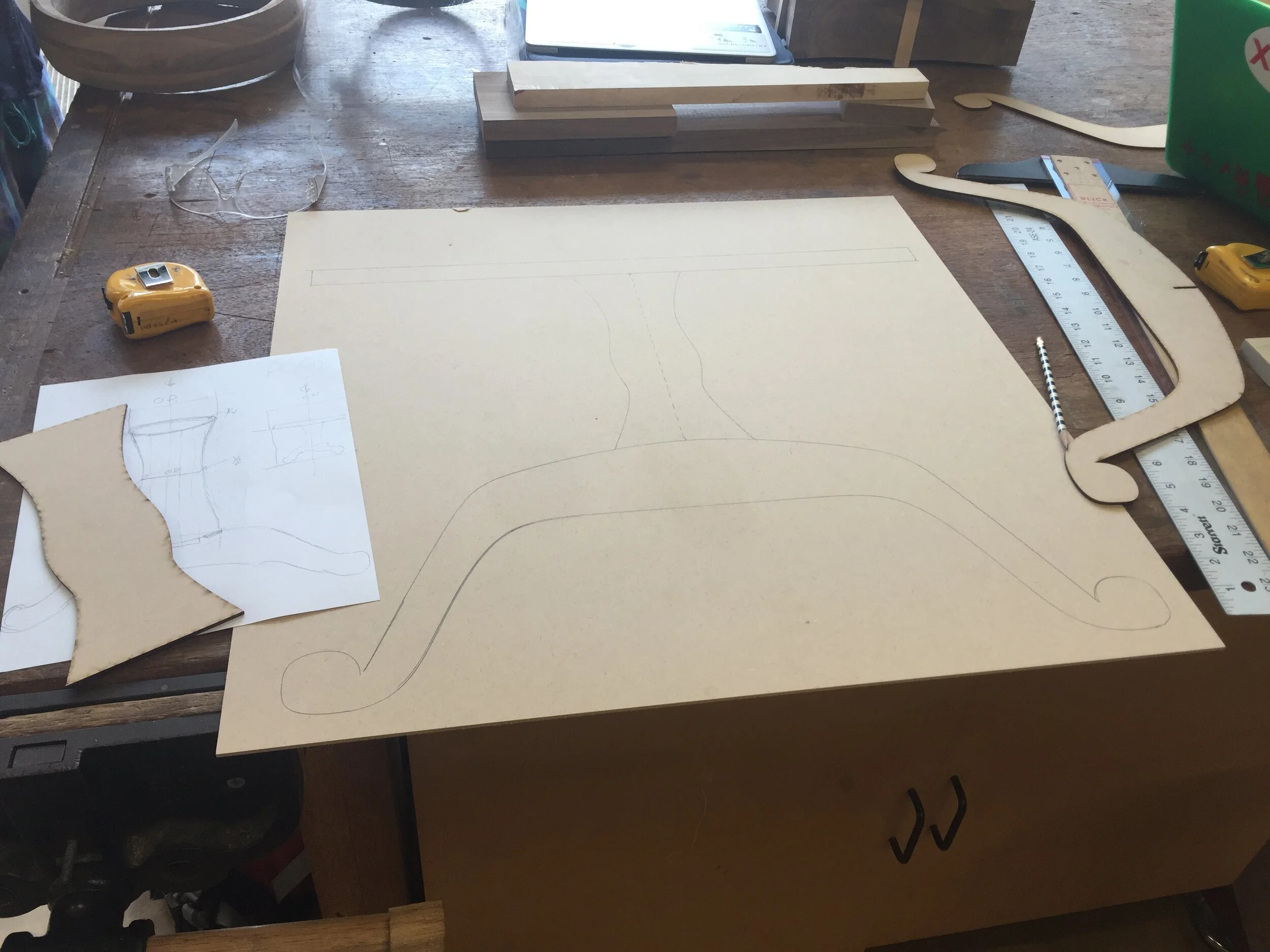 Full size prototype of center shaft shape and size, with added leg shape and tabletop for scale