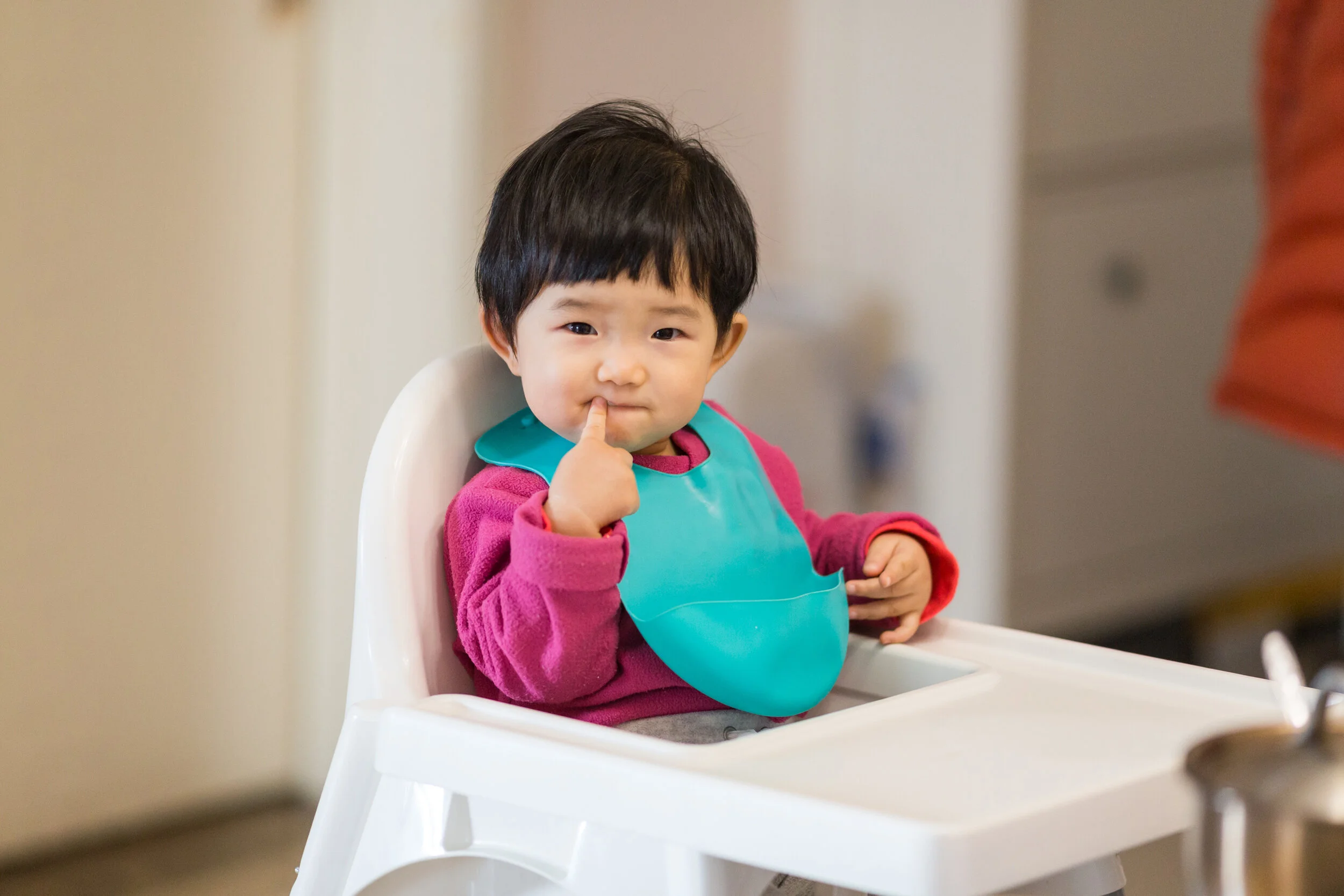 Cute-baby-Sitting-in-a-high-chair-waiting-for-to-eat-dinner-923699560_3000x2000.jpeg