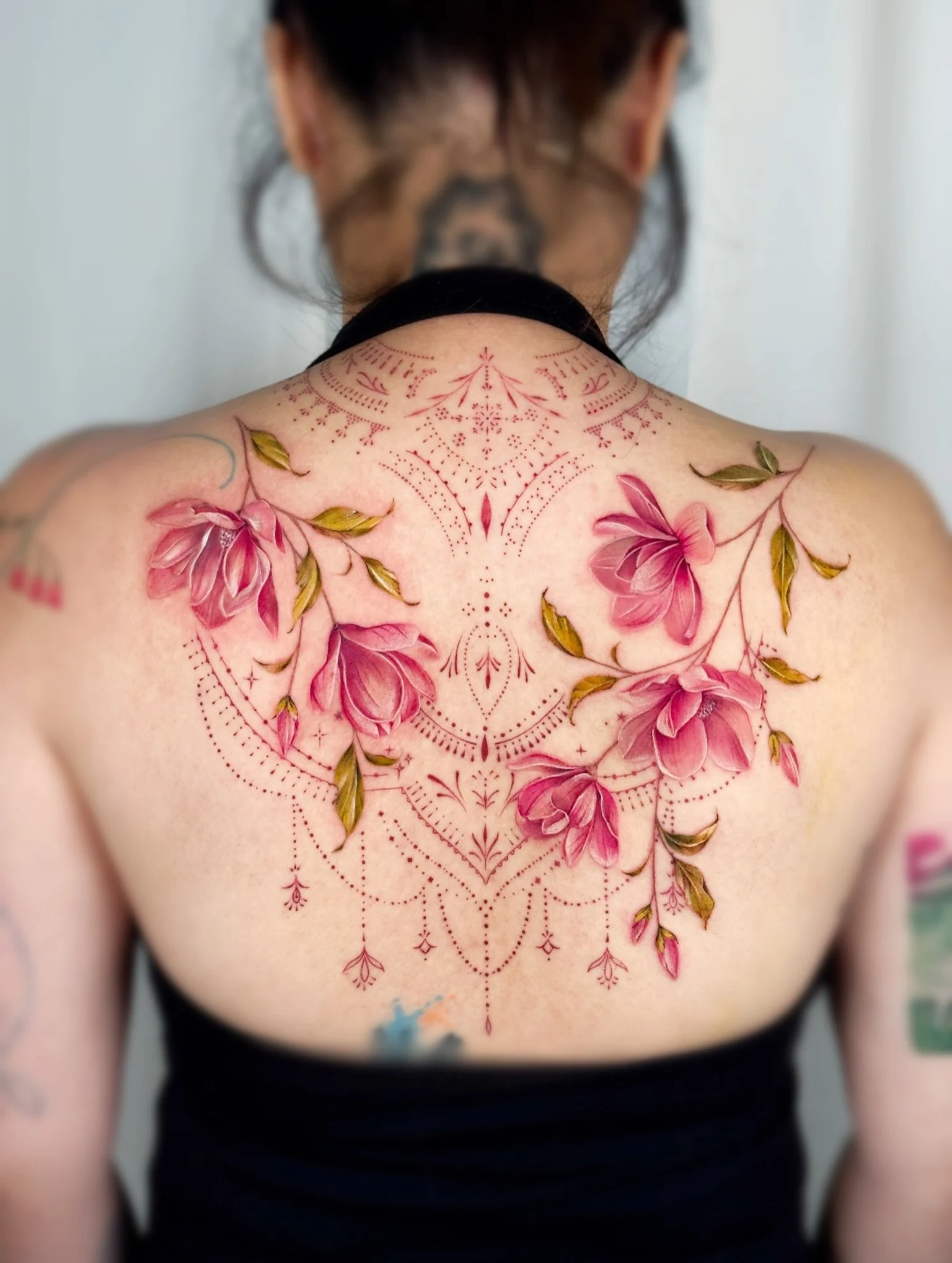 With over a decade of professional experience, G.NO has established herself as one of Toronto&rsquo;s premier watercolor and botanical tattoo artists. Her work is known for its soft, painterly quality, blending organic movement with delicate color to