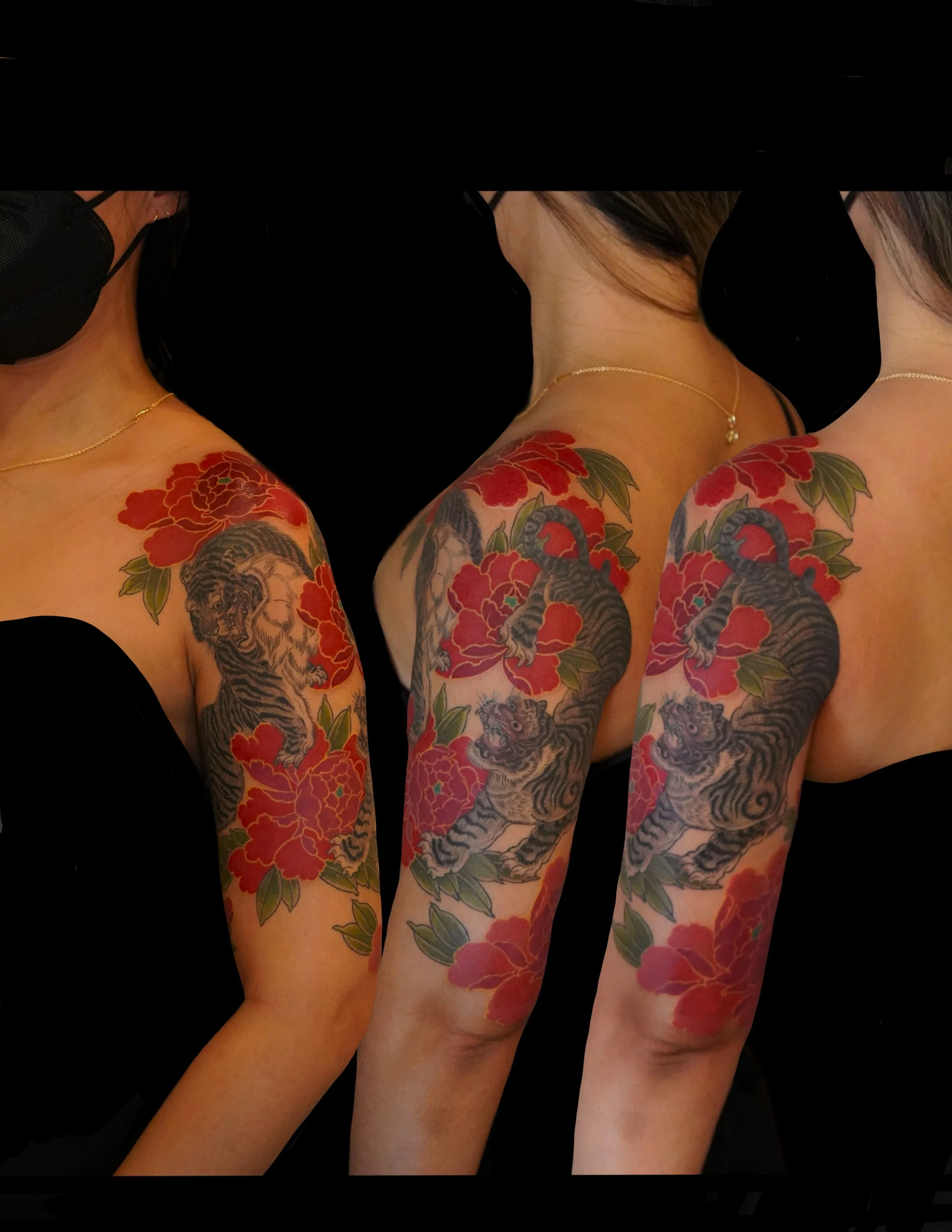 Tattooed woman with a tiger and floral design on arm