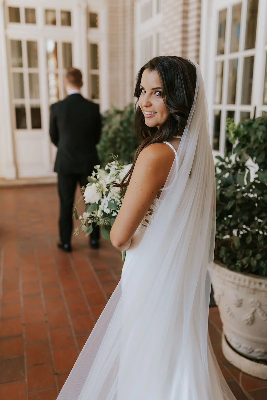 first look with a brunette bride and her groom on wedding day at the georgian terrace hotel
