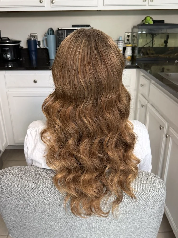 bridal hairstyle featuring glam waves on red hair