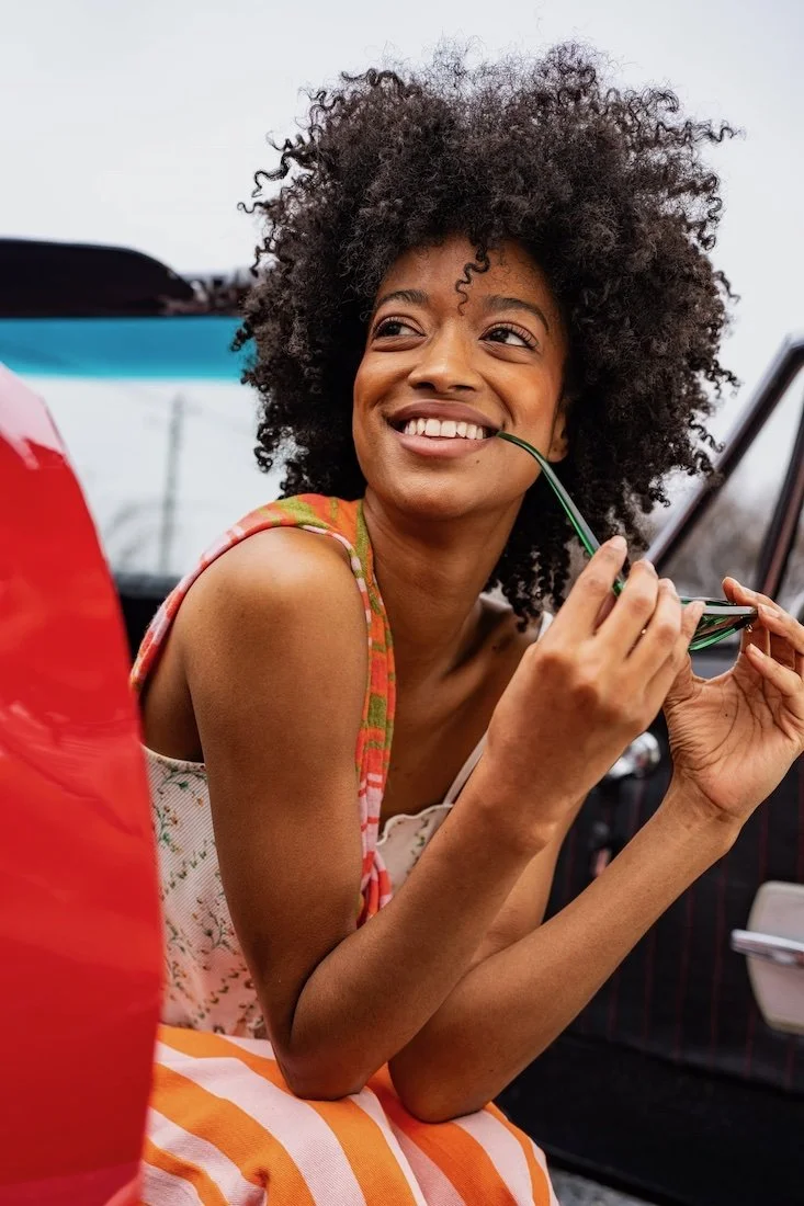 commercial photo shoot displaying makeup on darker skin tones