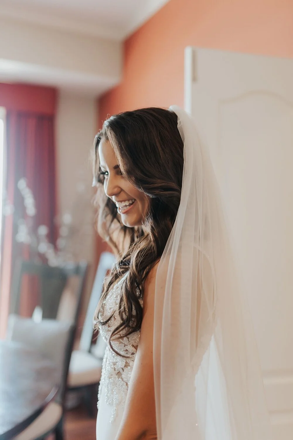 professional wedding day photo of a brunette bride with a classic down hairstyle