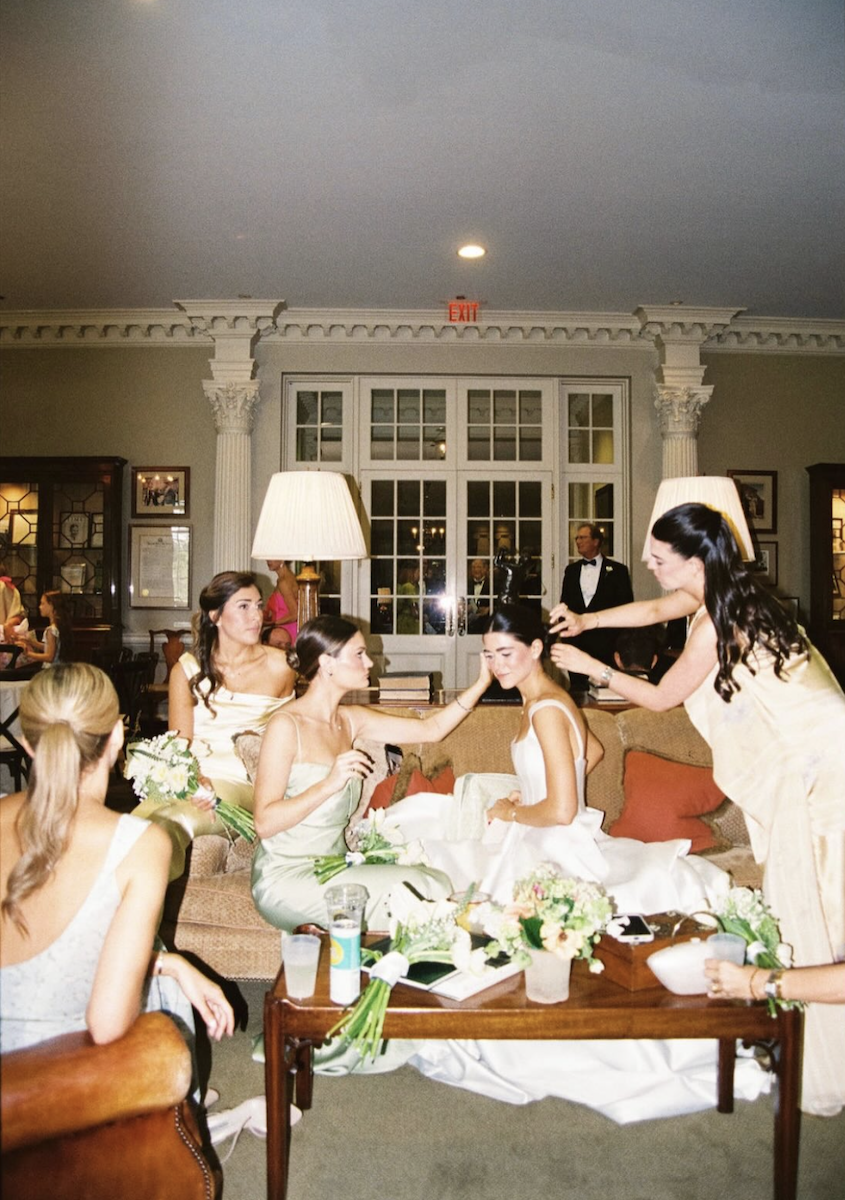 film photo of a bride and her bridesmaids getting ready inside a golf club in atlanta