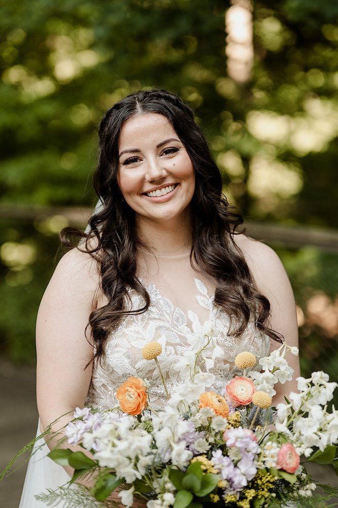 natural bridal makeup for a brunette bride with fair skin and a half up half down hairstyle