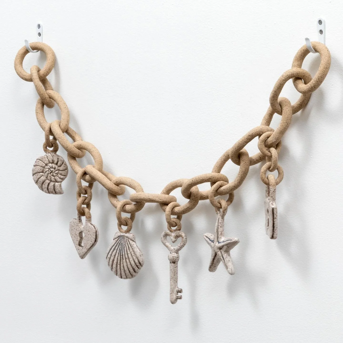 𝑹𝒆𝒍𝒊𝒄𝒔 is the third piece in my collection, debuting next weekend at the Detroit Warehouse Art &amp; Design Fair in the Boyer Campbell building.
This work feels like an artifact from a forgotten shore. It&rsquo;s a shrine to gathered shells and